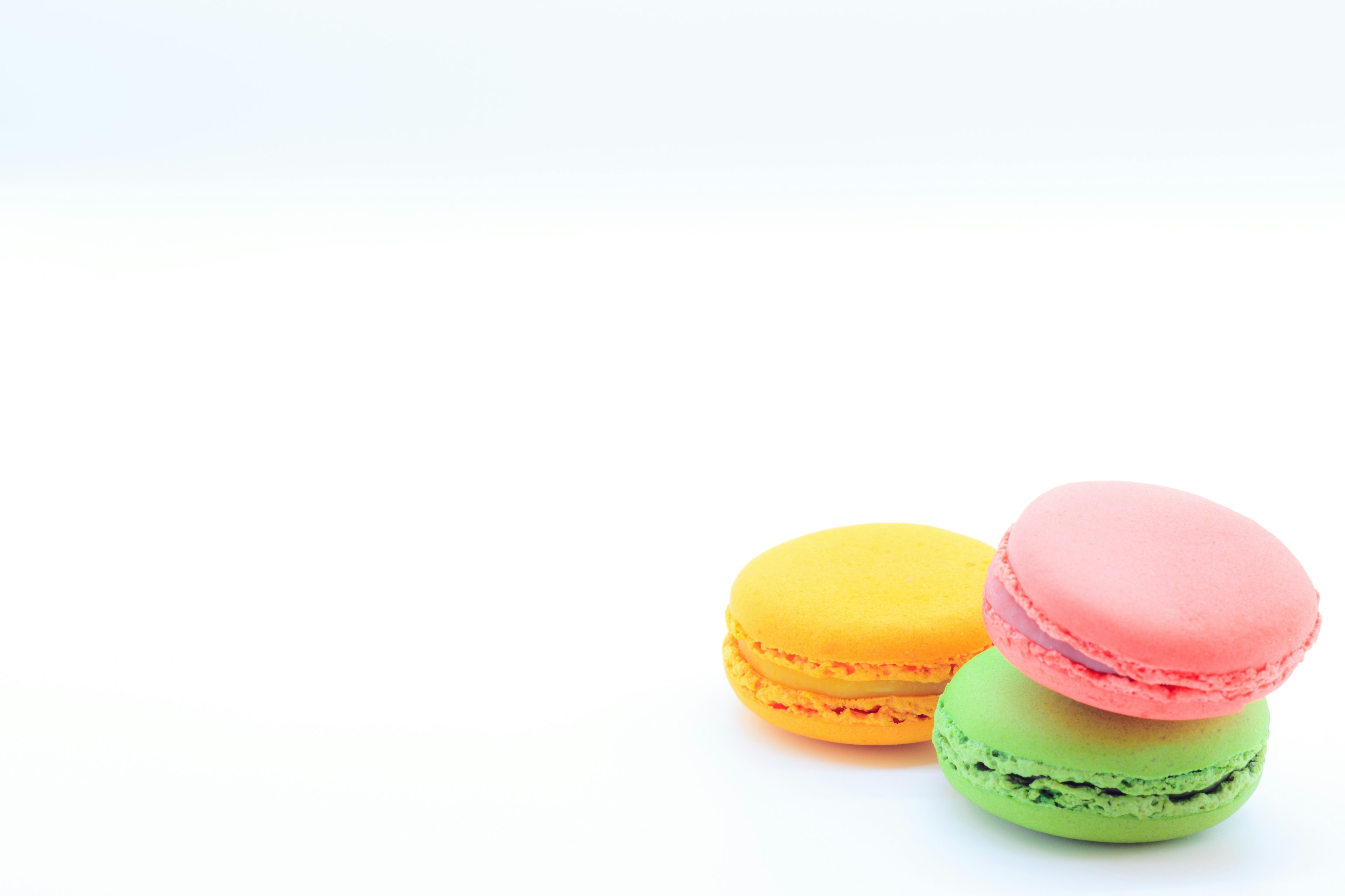 Colorful macarons placed on a white background