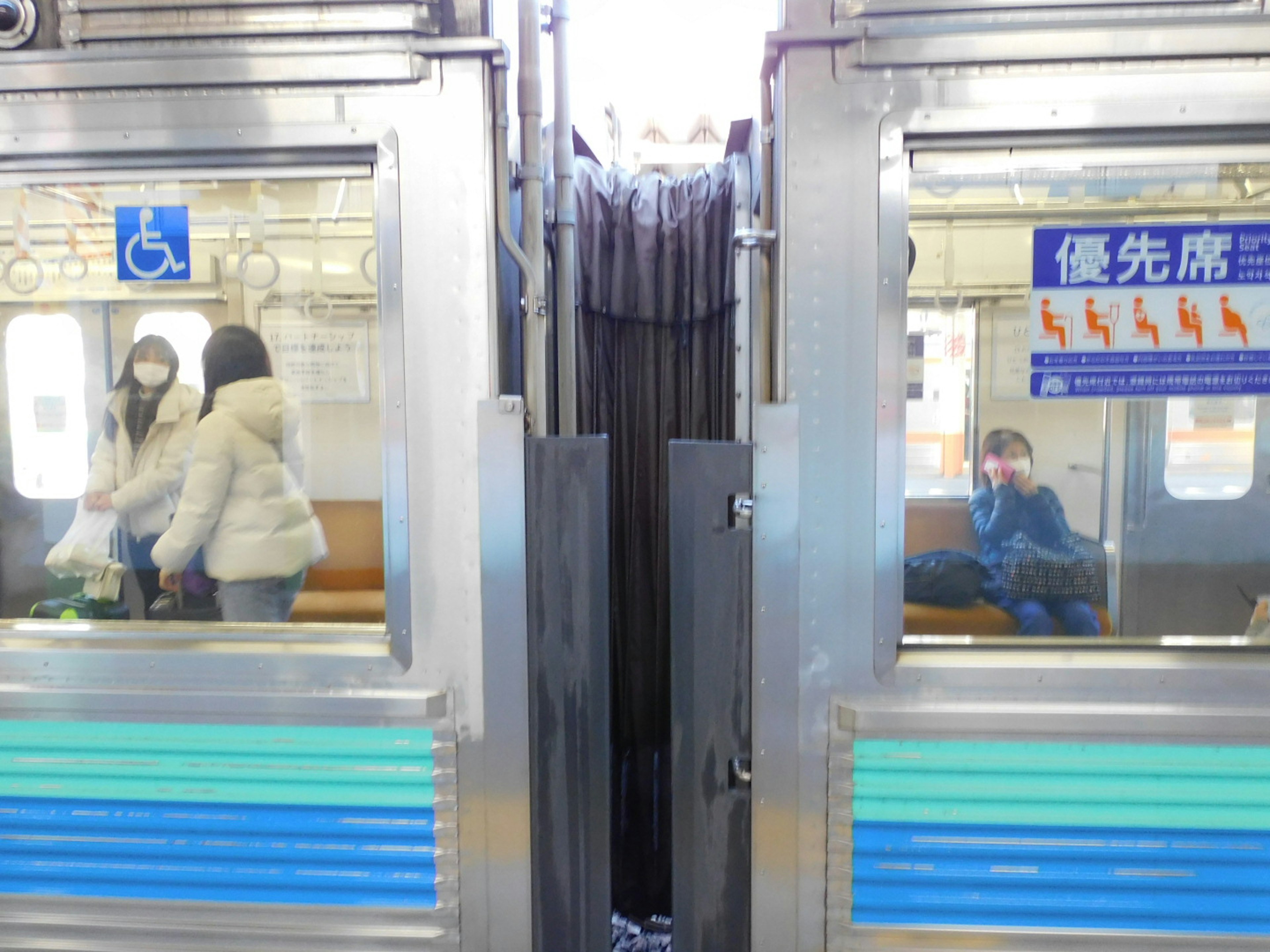 Interior view of a train compartment showing seating arrangement