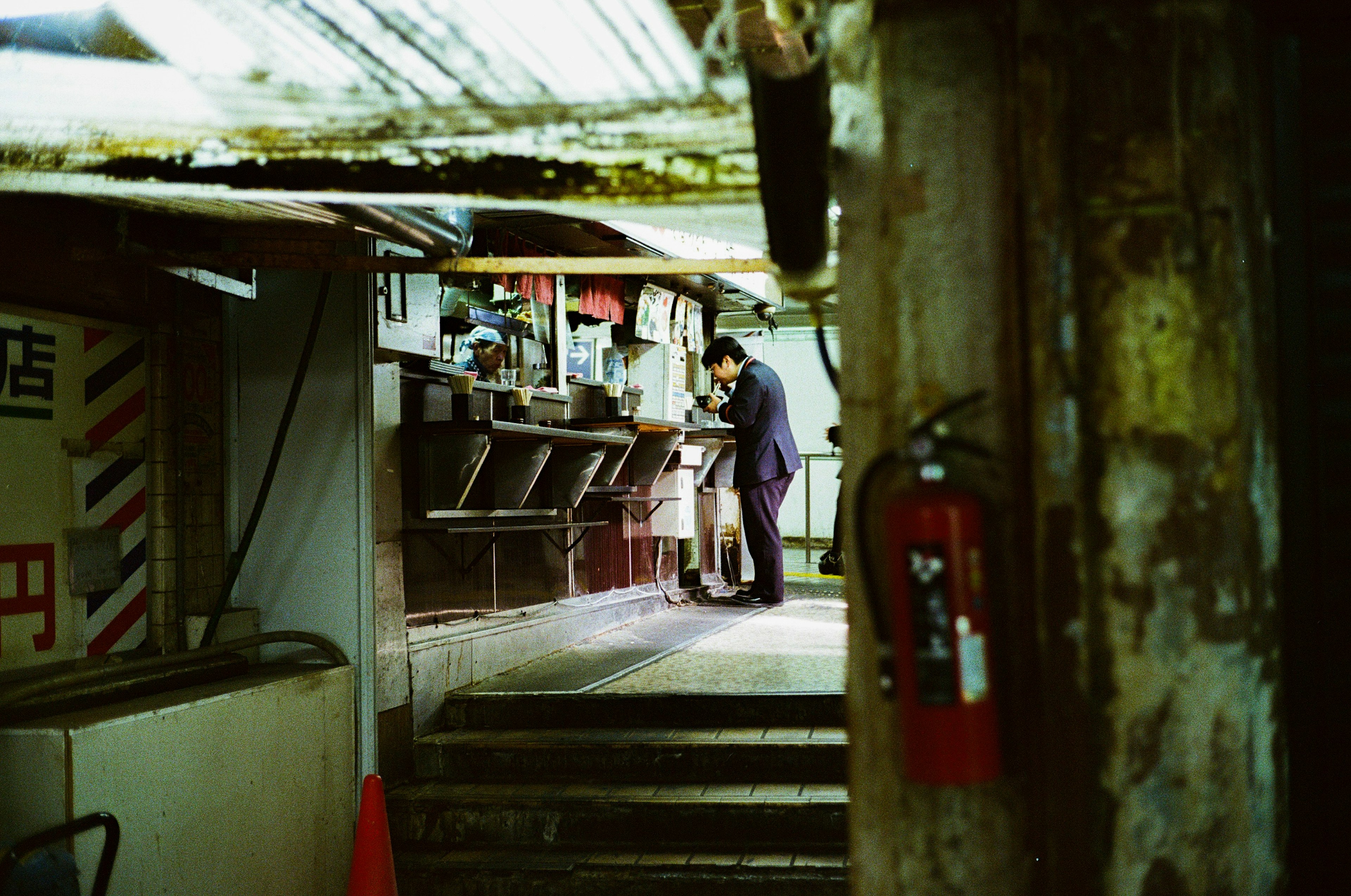 A man working in an underground eatery with vintage decor