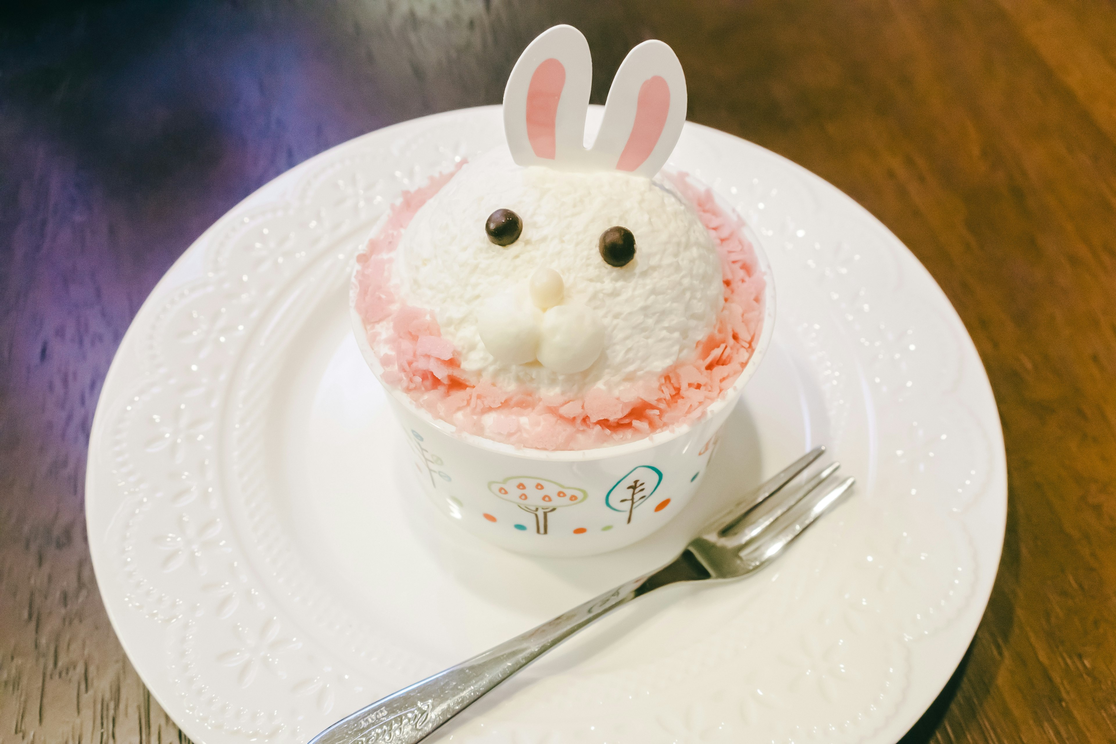 Cute rabbit-shaped dessert decorated with pink cream