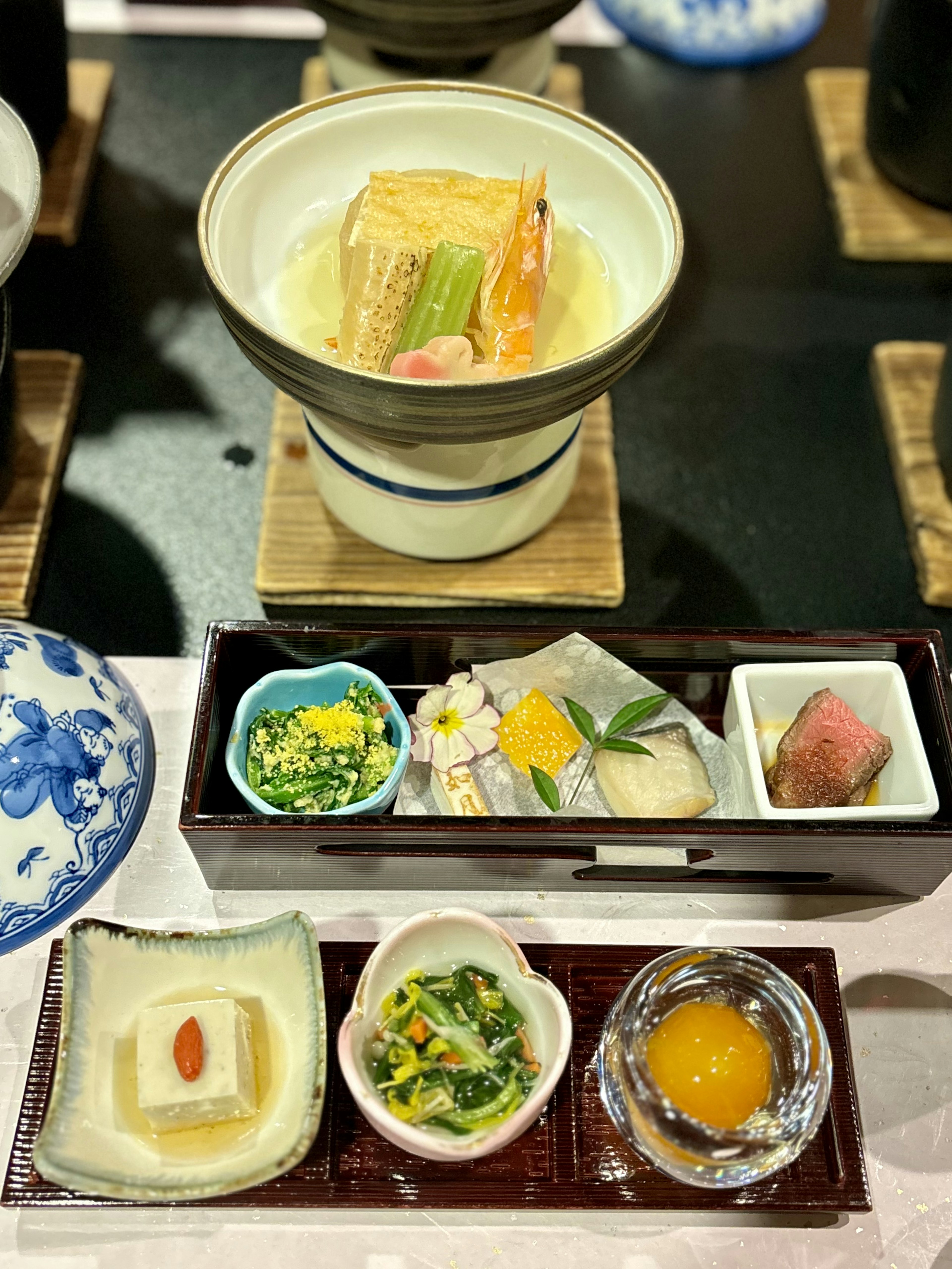 A beautifully arranged kaiseki dish featuring various delicacies