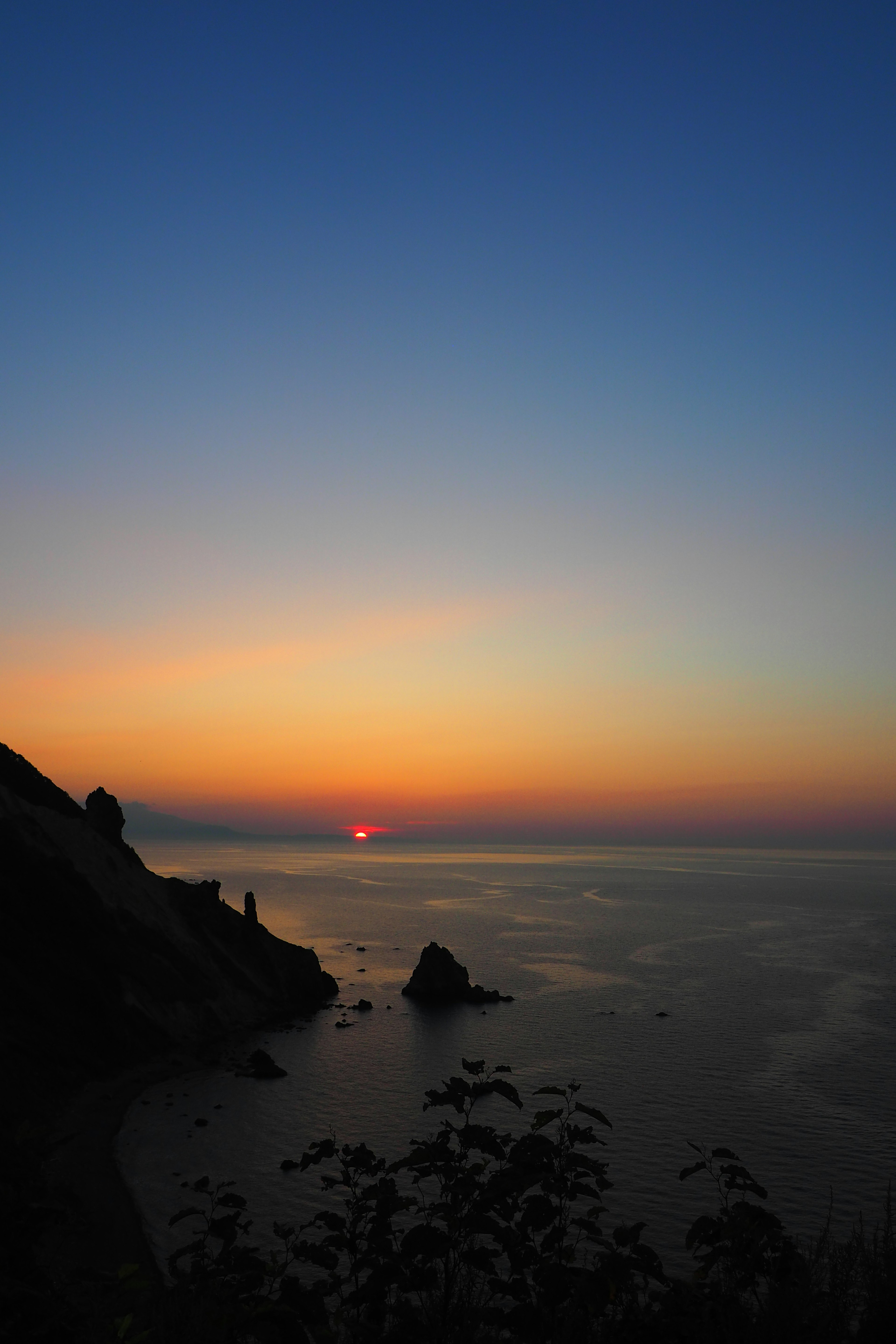 Sunset over the ocean with vibrant sky colors