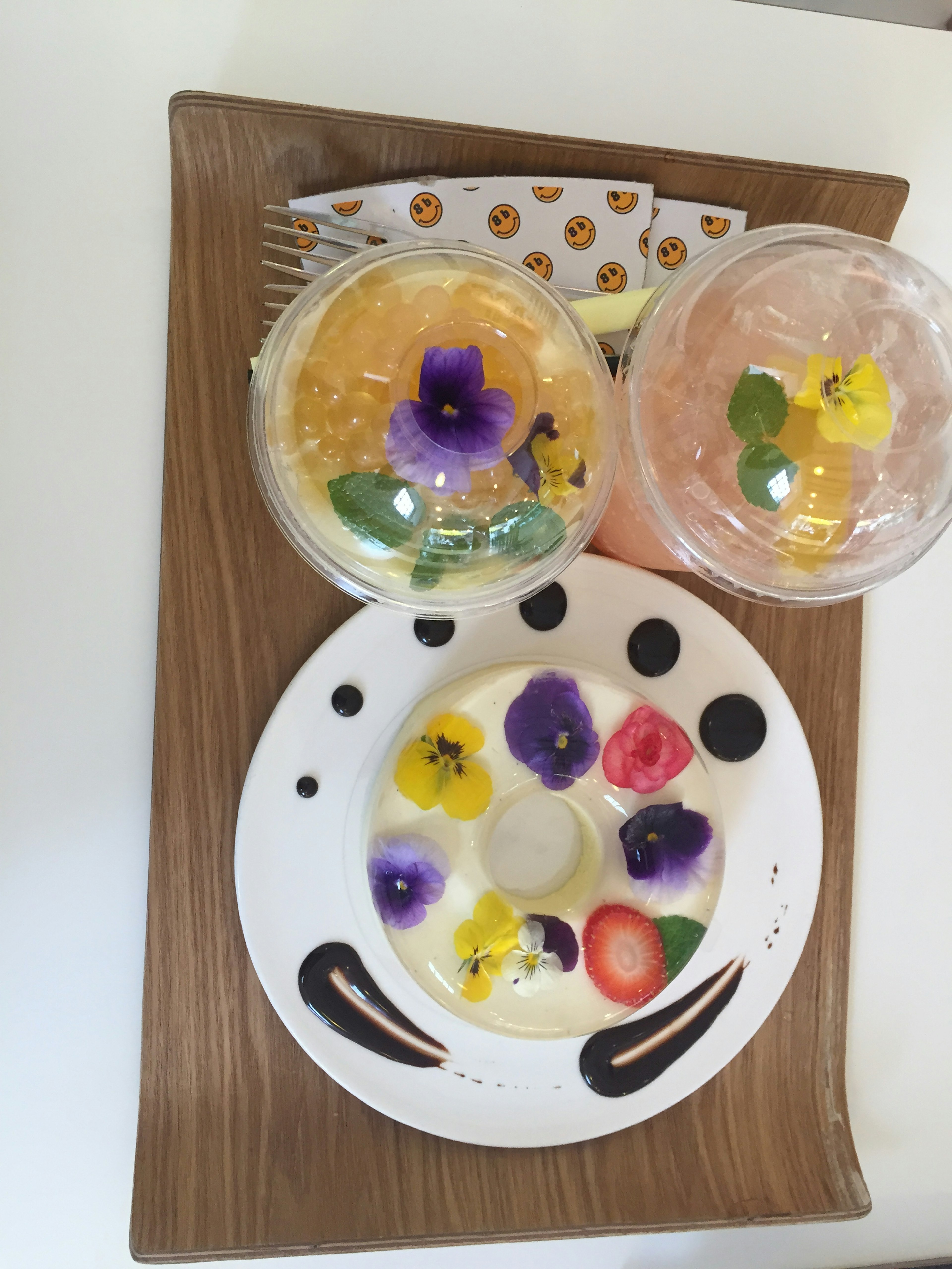 Colorful dessert and drinks beautifully arranged on a plate