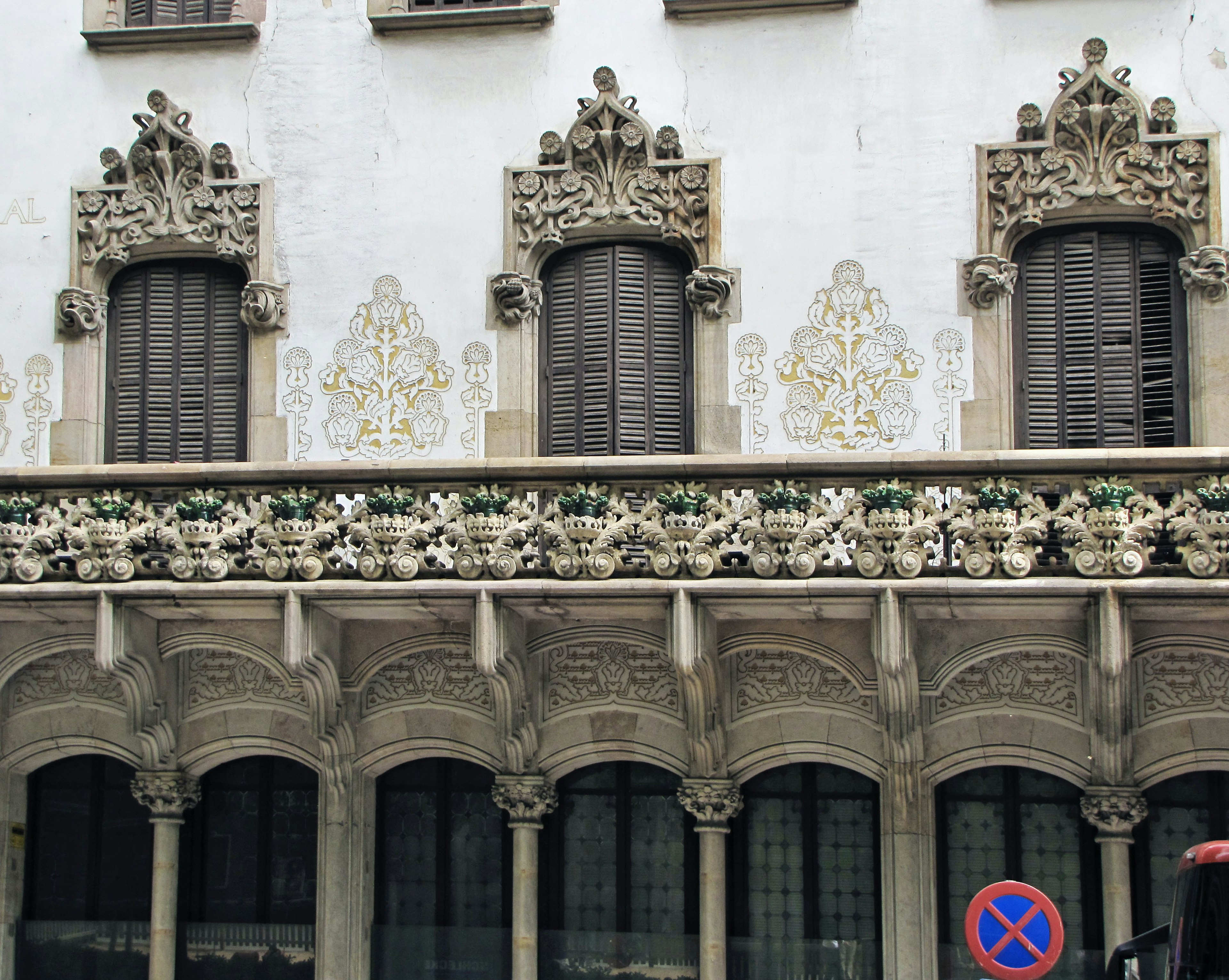 Facade of a beautiful building with decorative balcony and sculpted windows