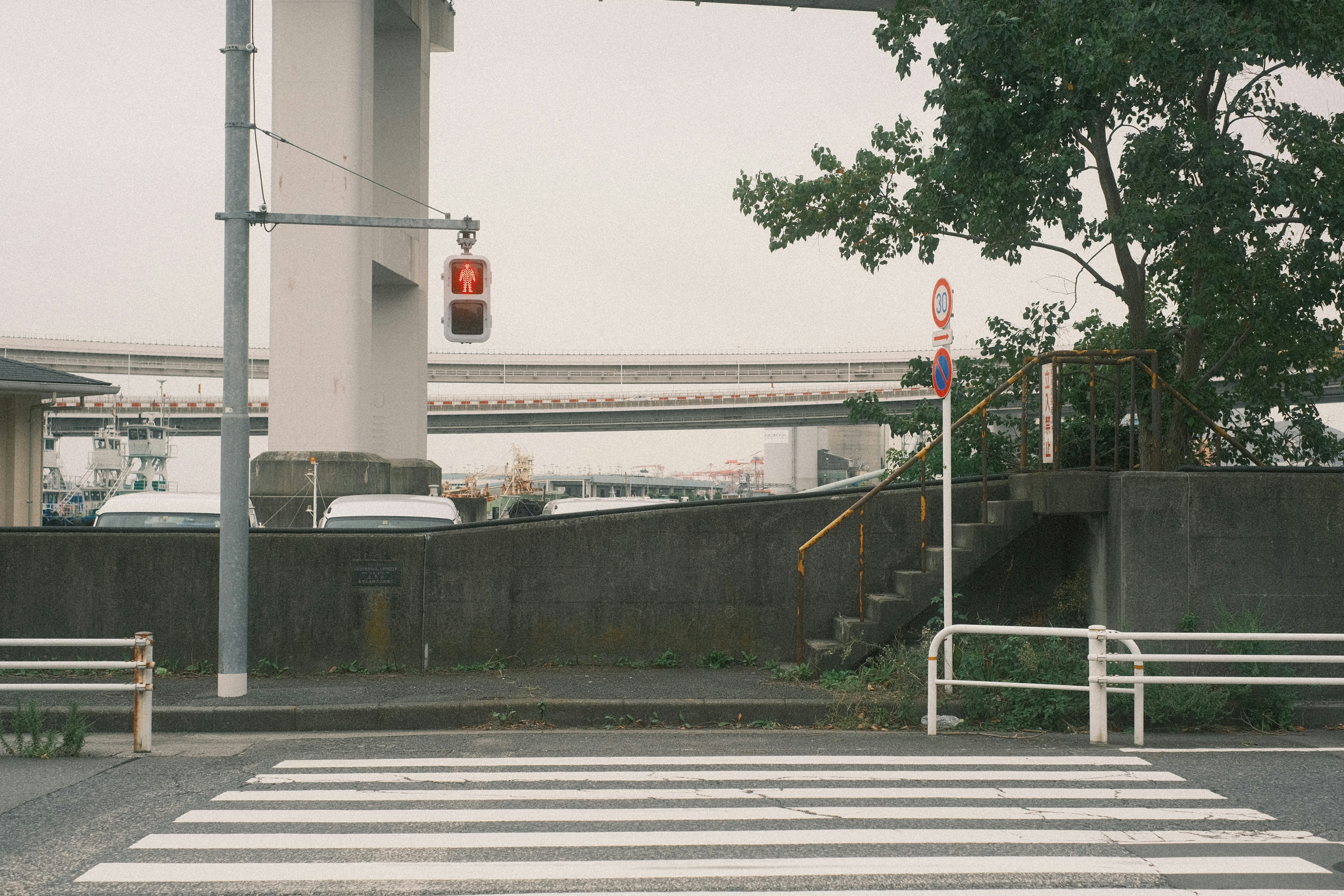 Intersection with red traffic light and stairs