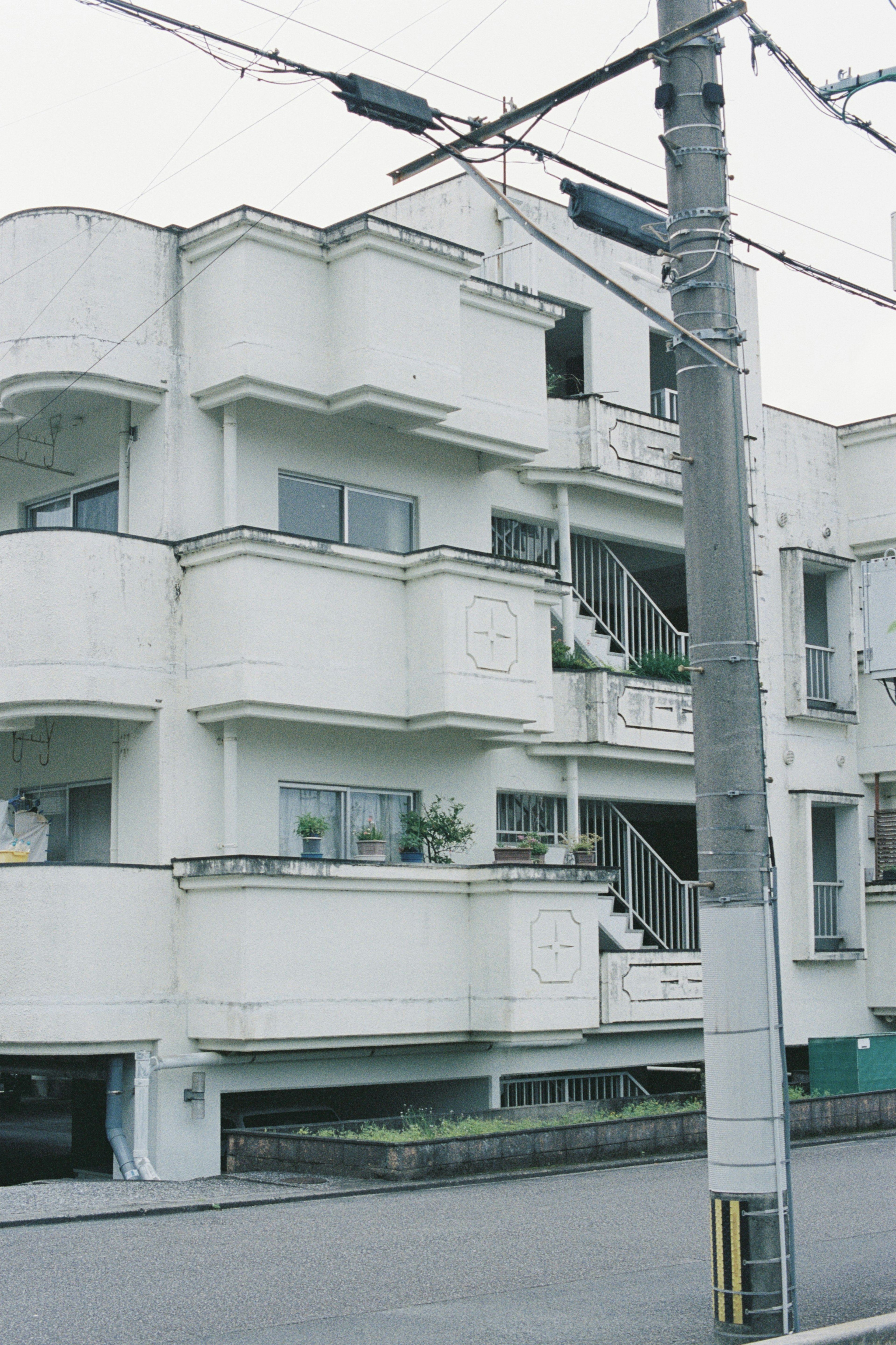 Exterior of a modern apartment building with white balconies