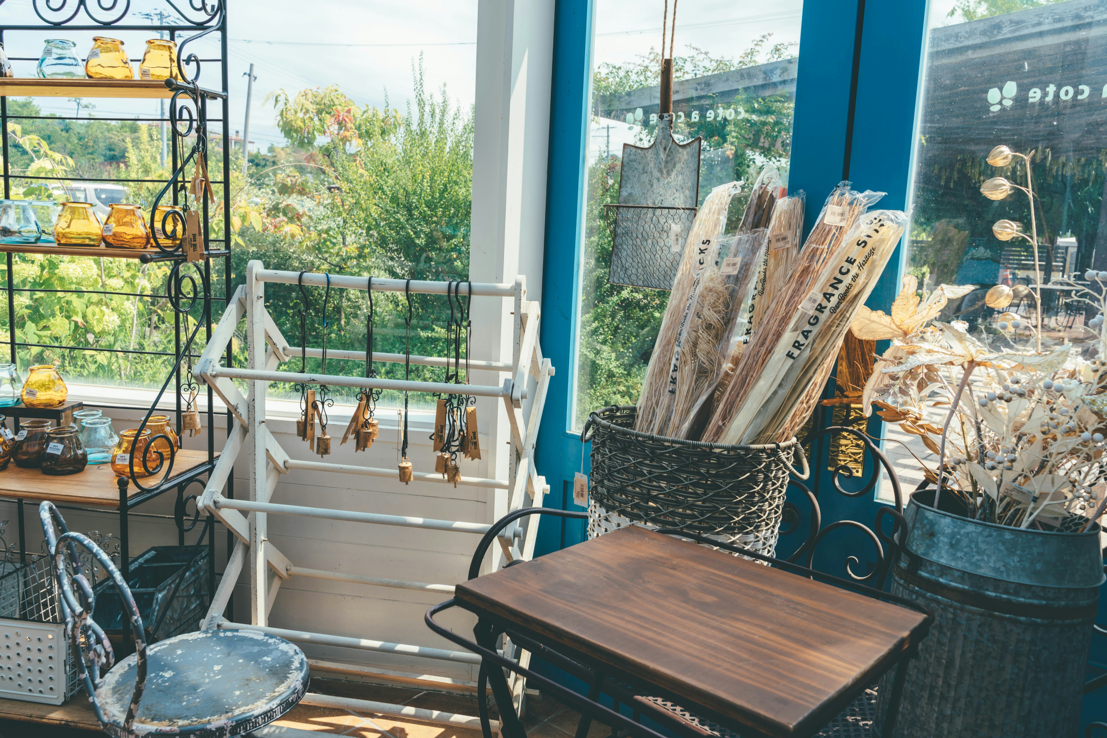 Bright window corner featuring decorative items and dried flower arrangements