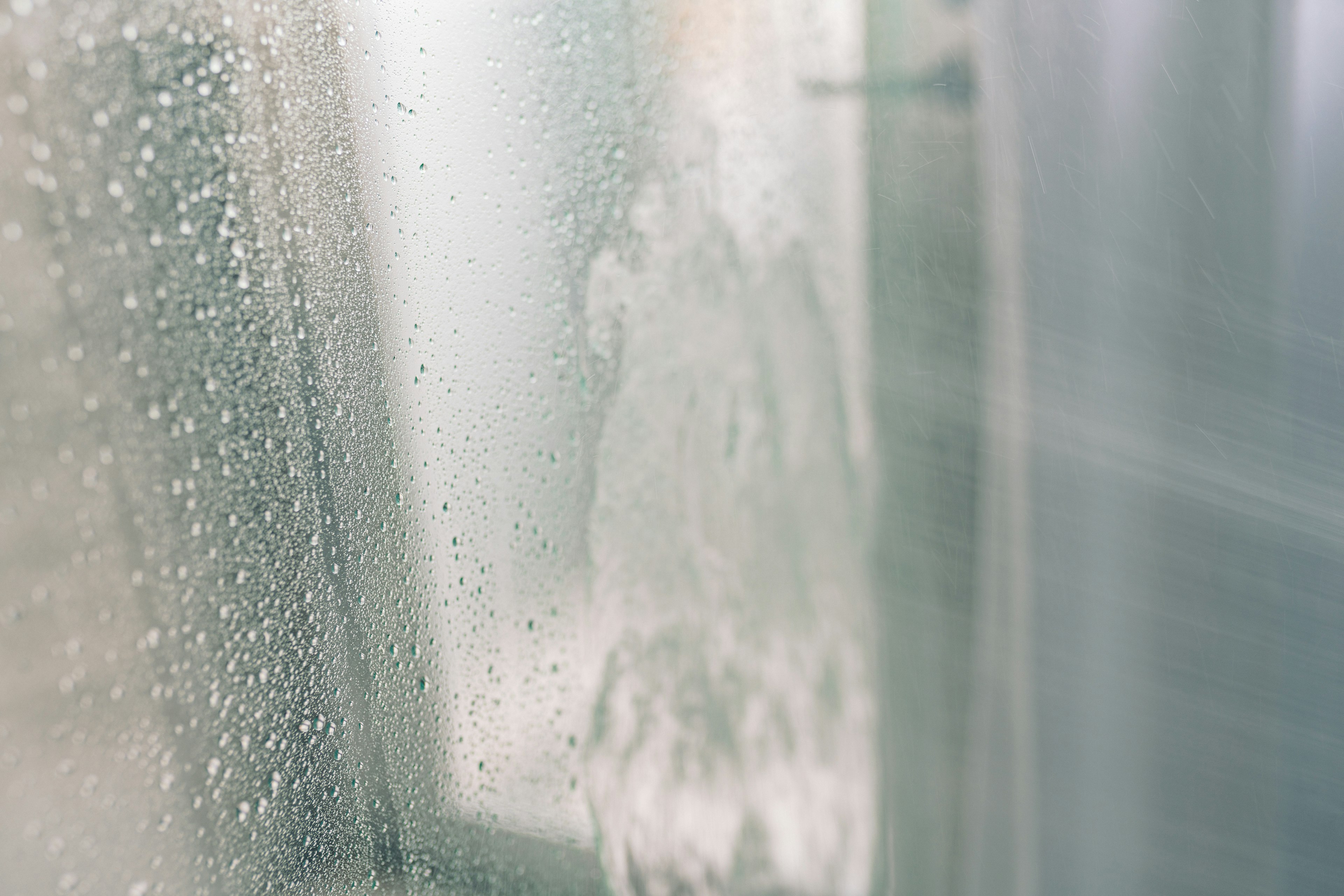 Condensation on a glass surface with water droplets