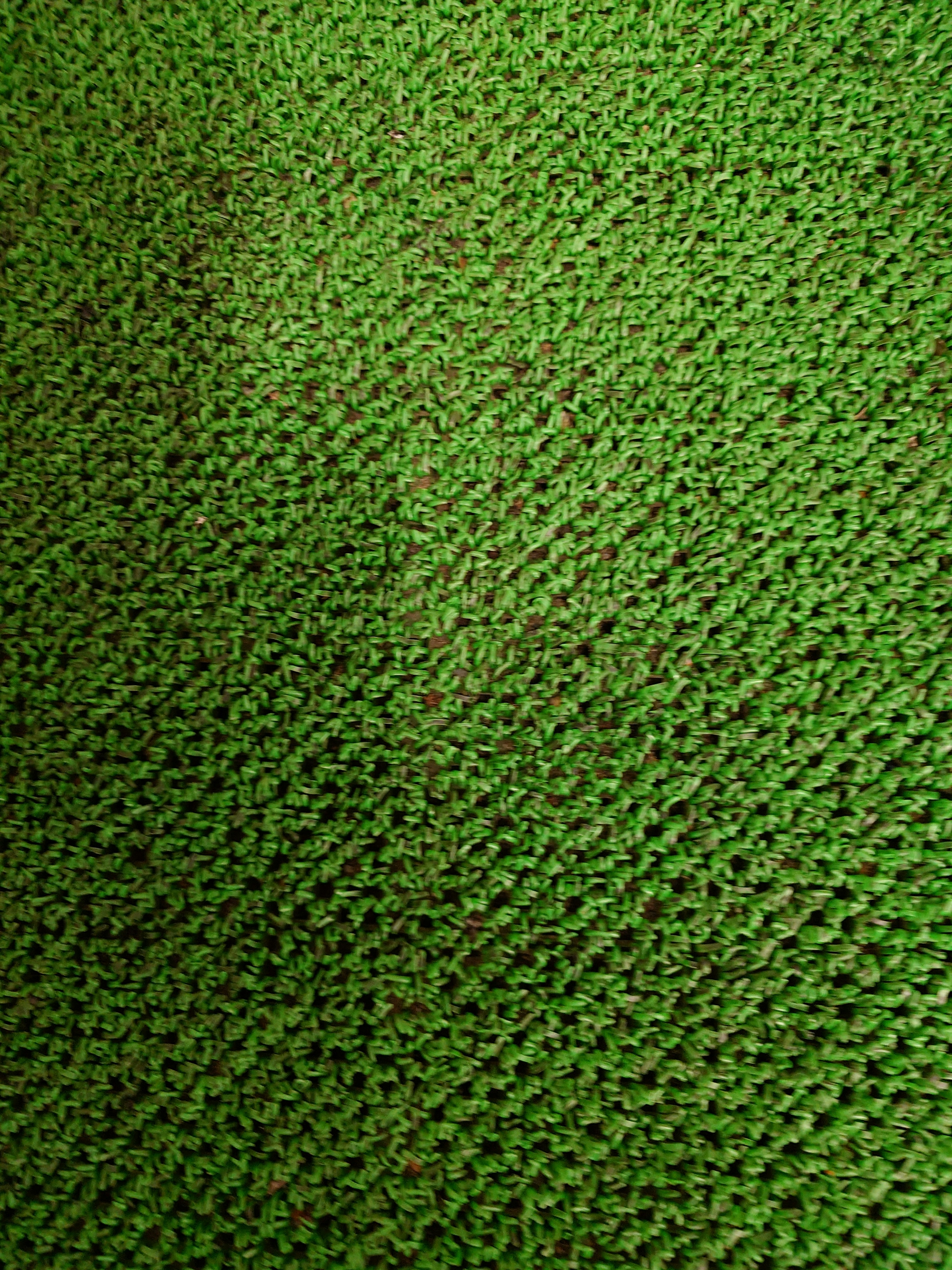 Textured green fabric with a knitted appearance