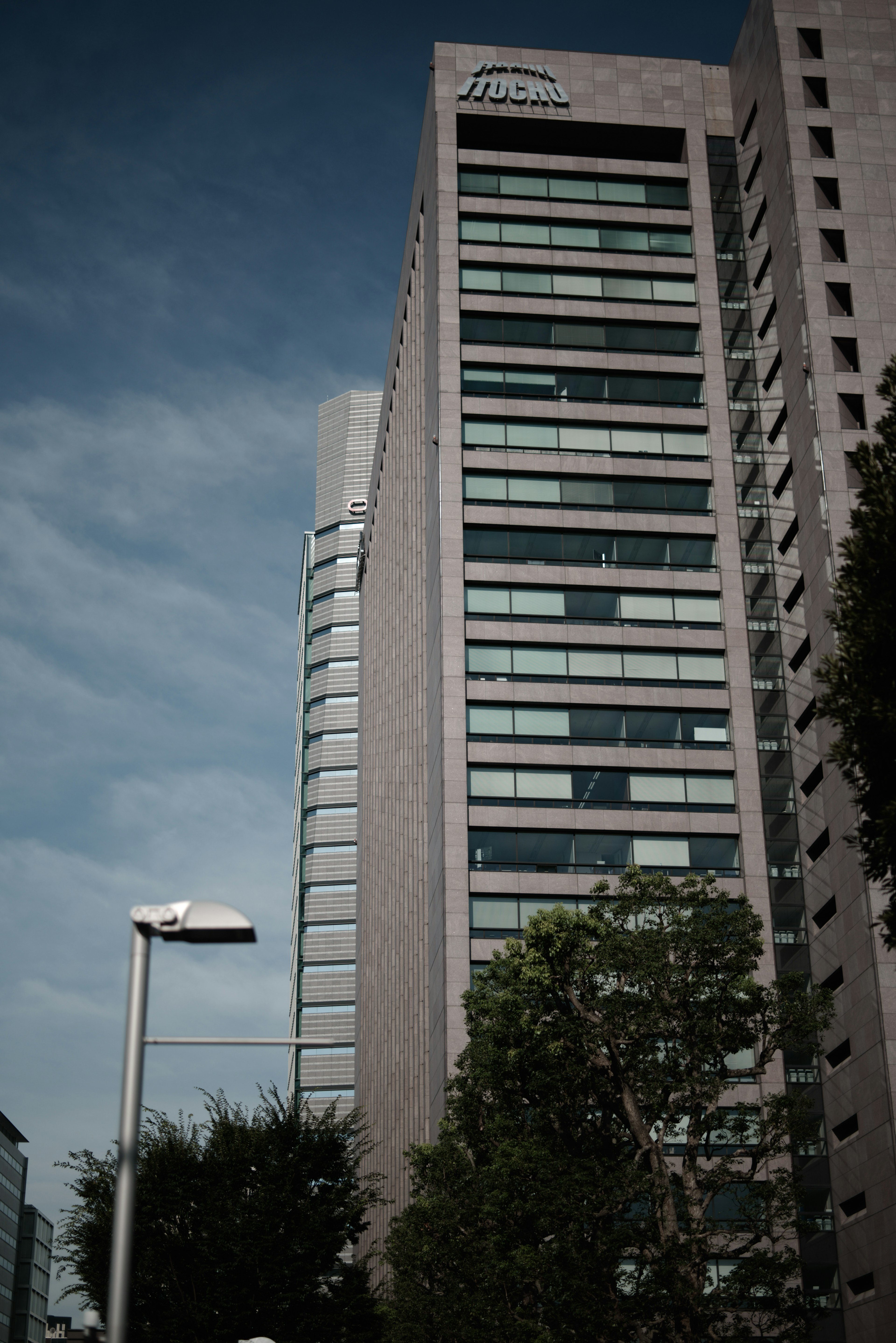 Facade of a tall building against a blue sky