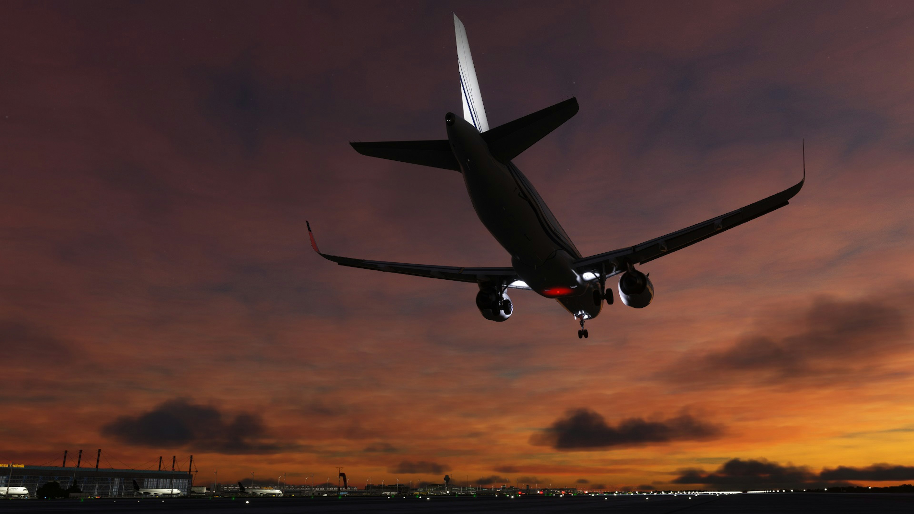 夕焼け空を背景に飛行機が離陸するシーン