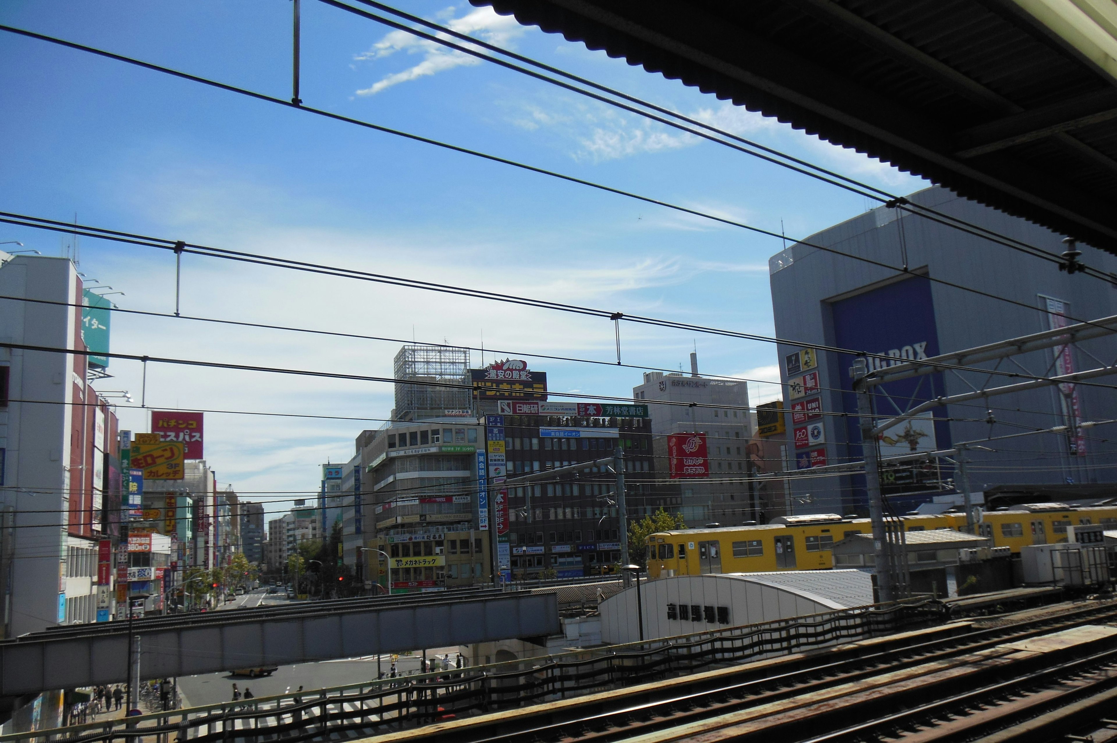 Urban landscape featuring blue sky and train tracks