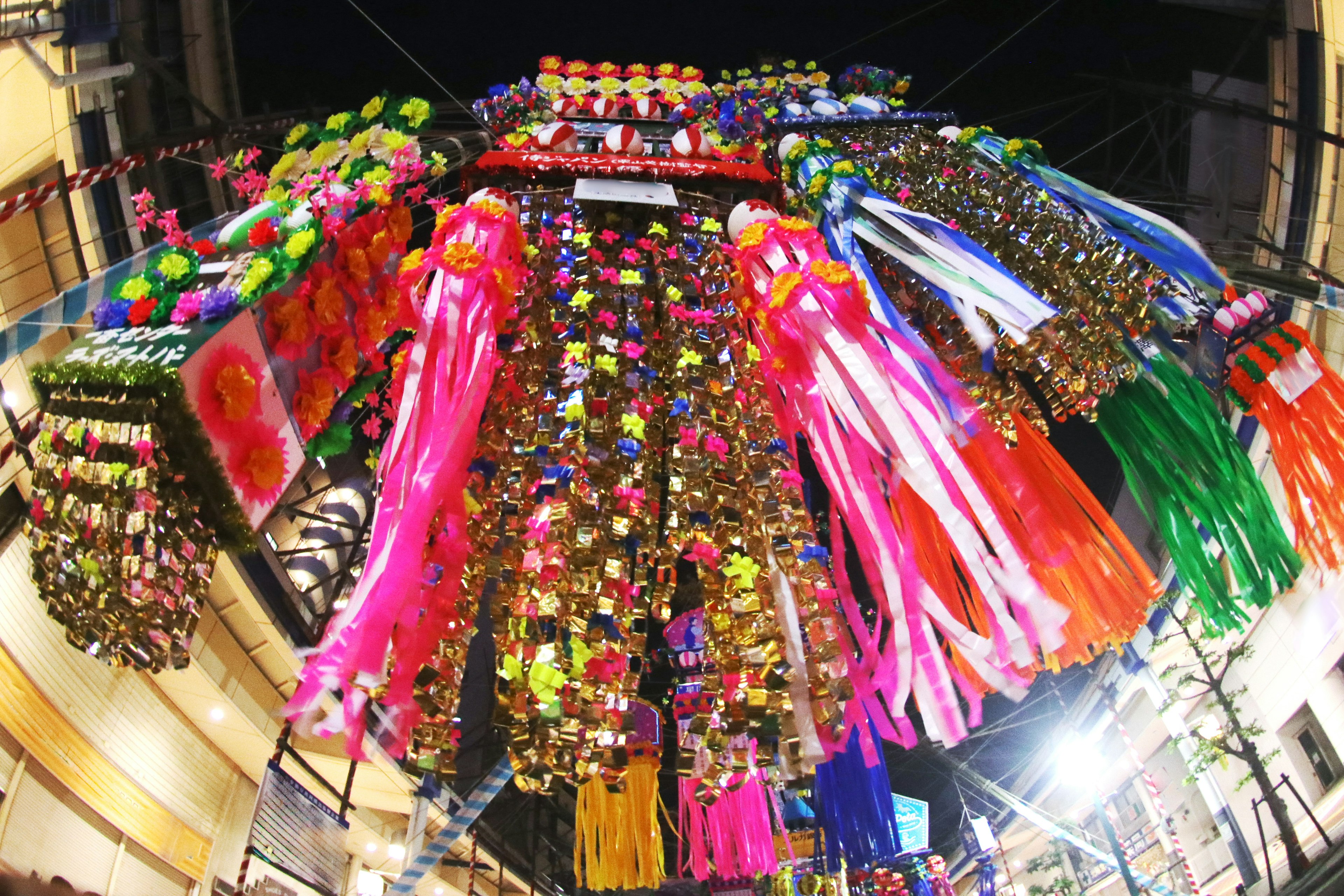 Colorful decorations hanging in a night market scene