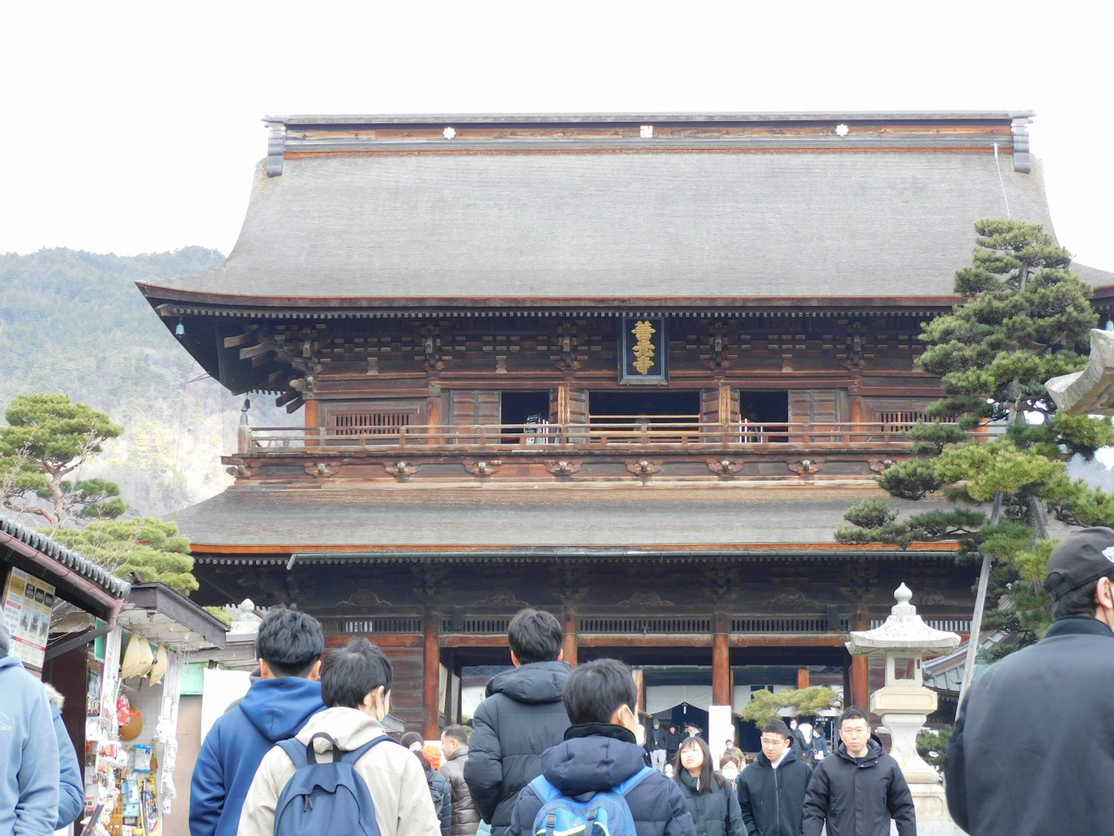 People visiting a traditional Japanese temple building