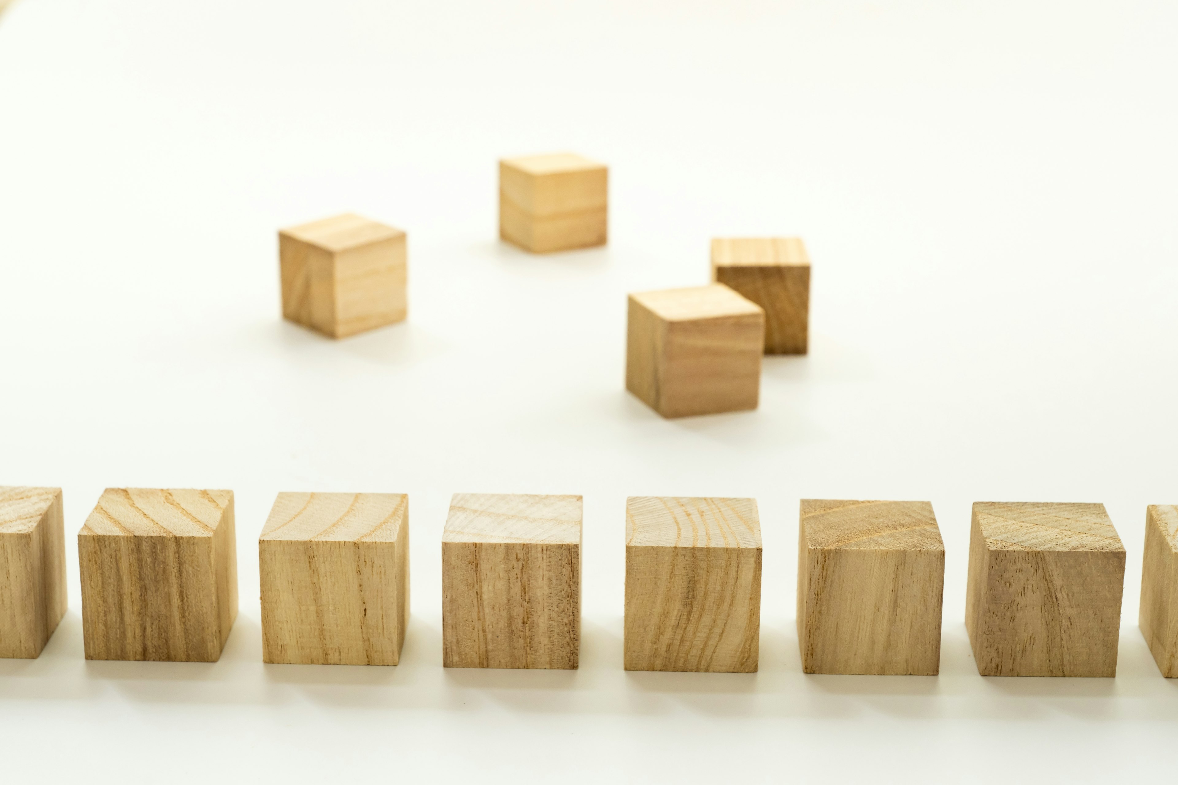 Wooden cubes arranged on a white background