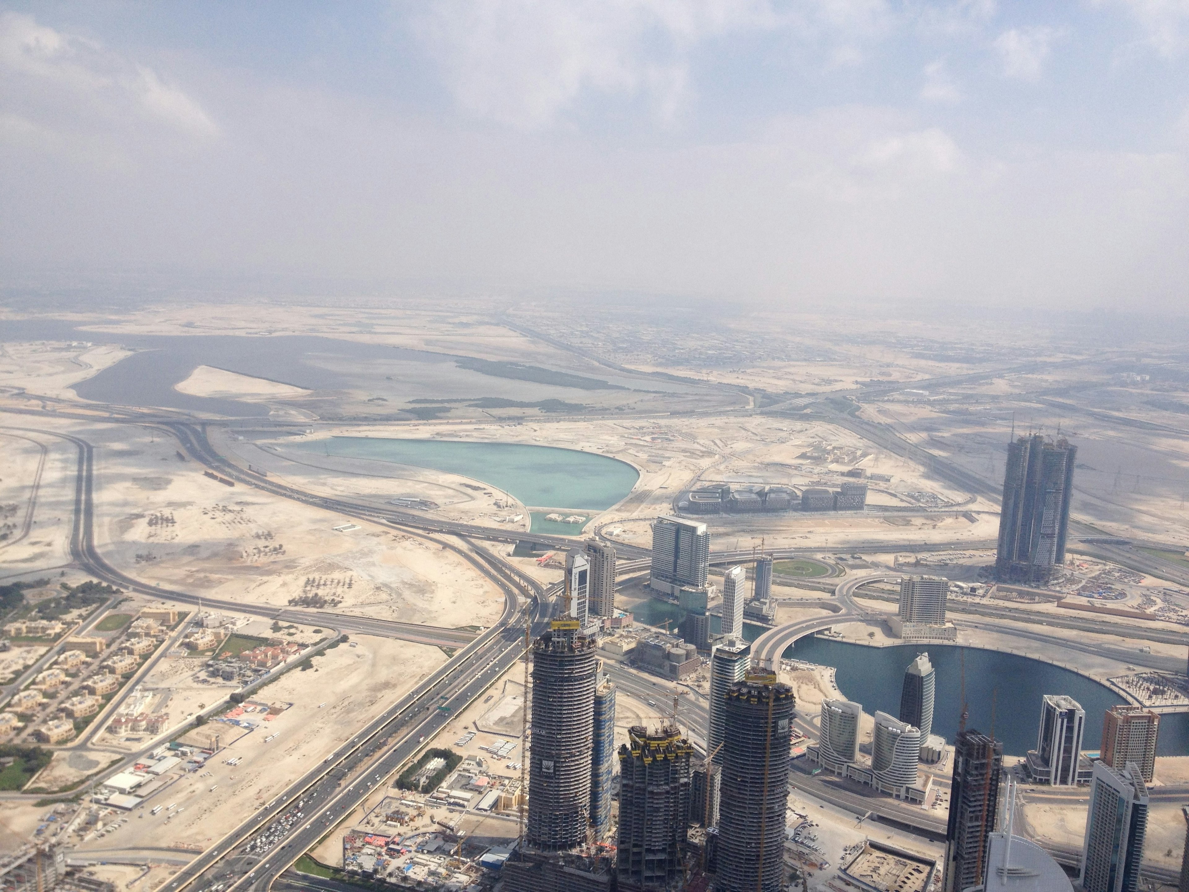 Aerial view of skyscrapers and vast desert landscape