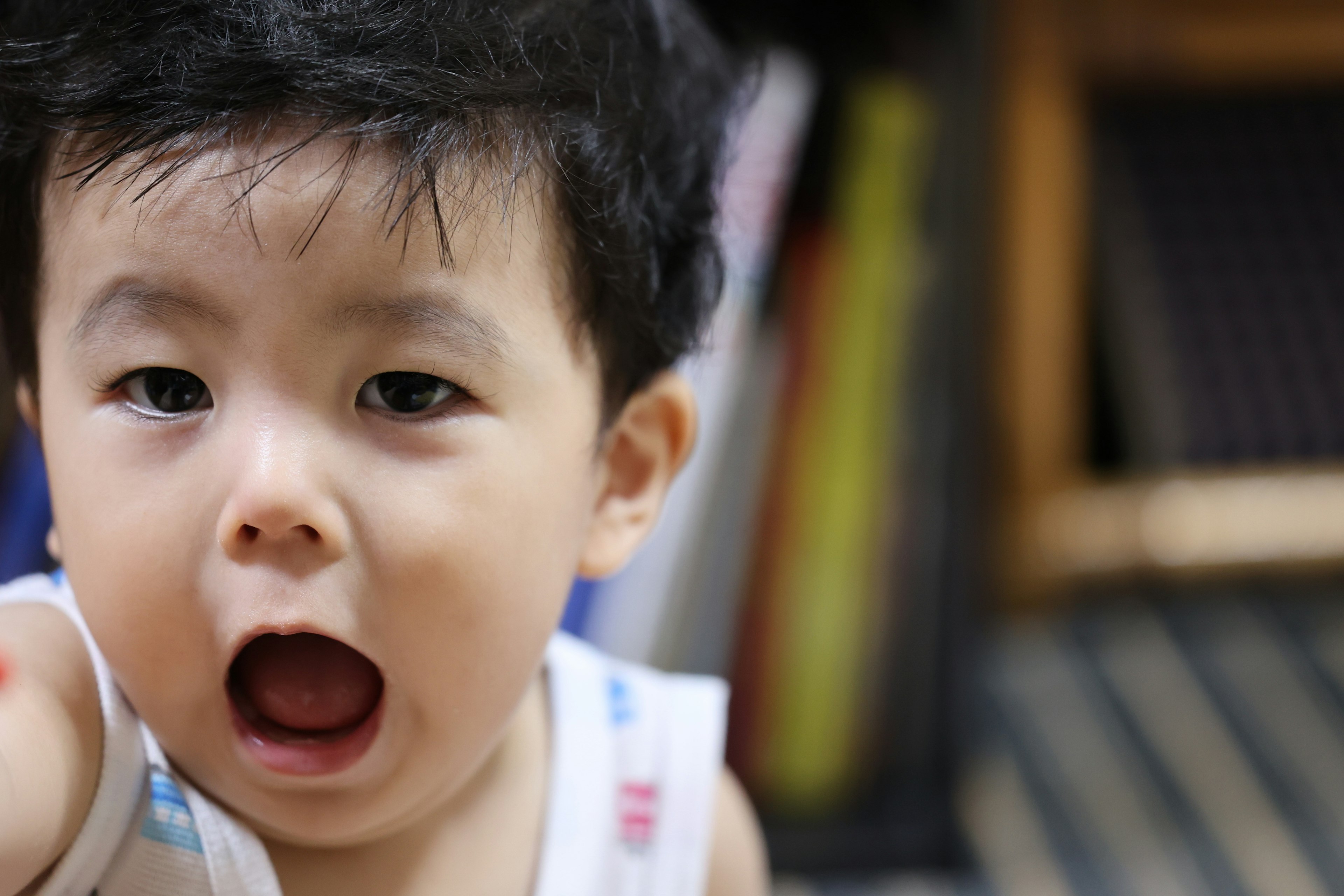 Cheerful child reaching out with a smile