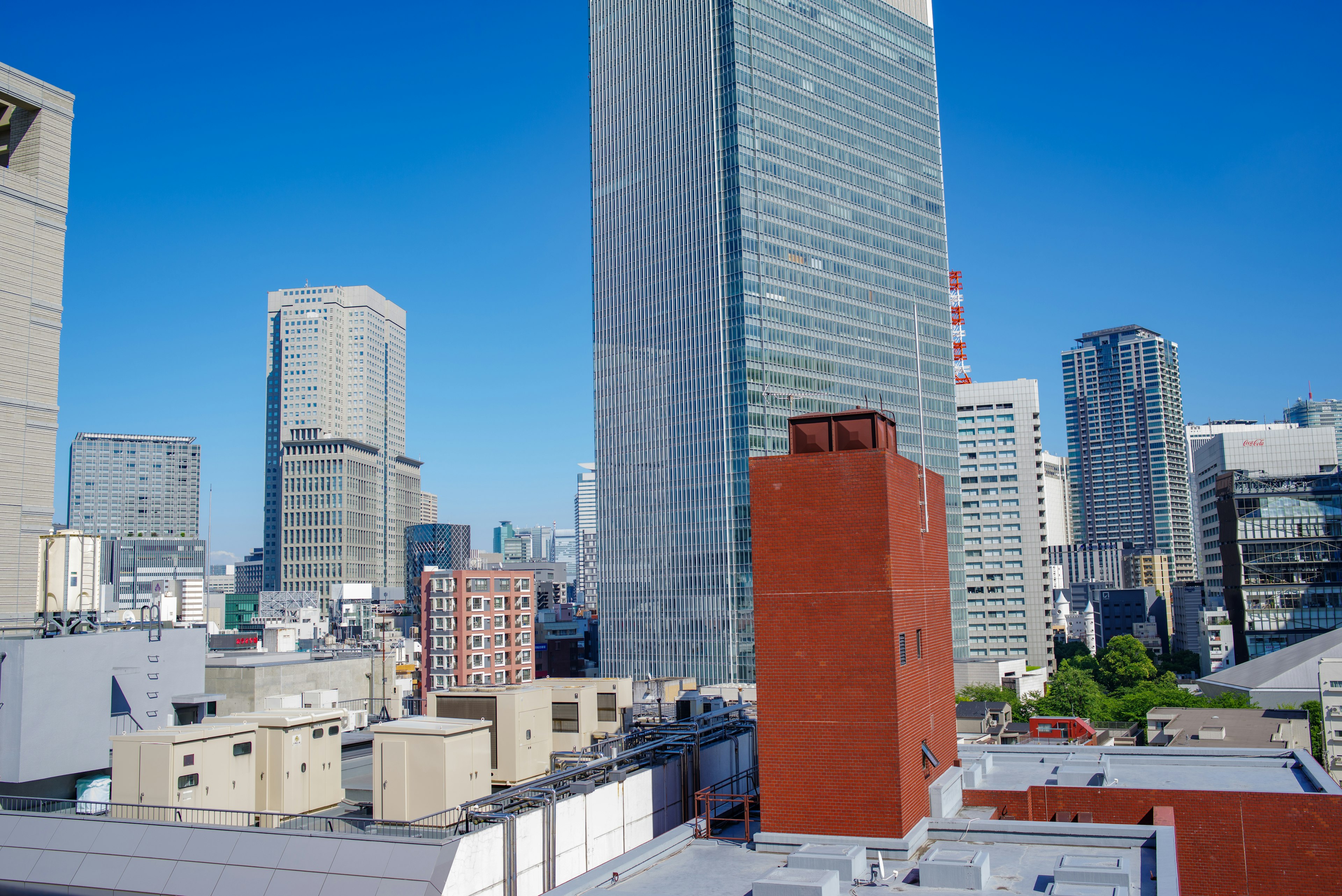 Urban skyline featuring skyscrapers and clear blue sky