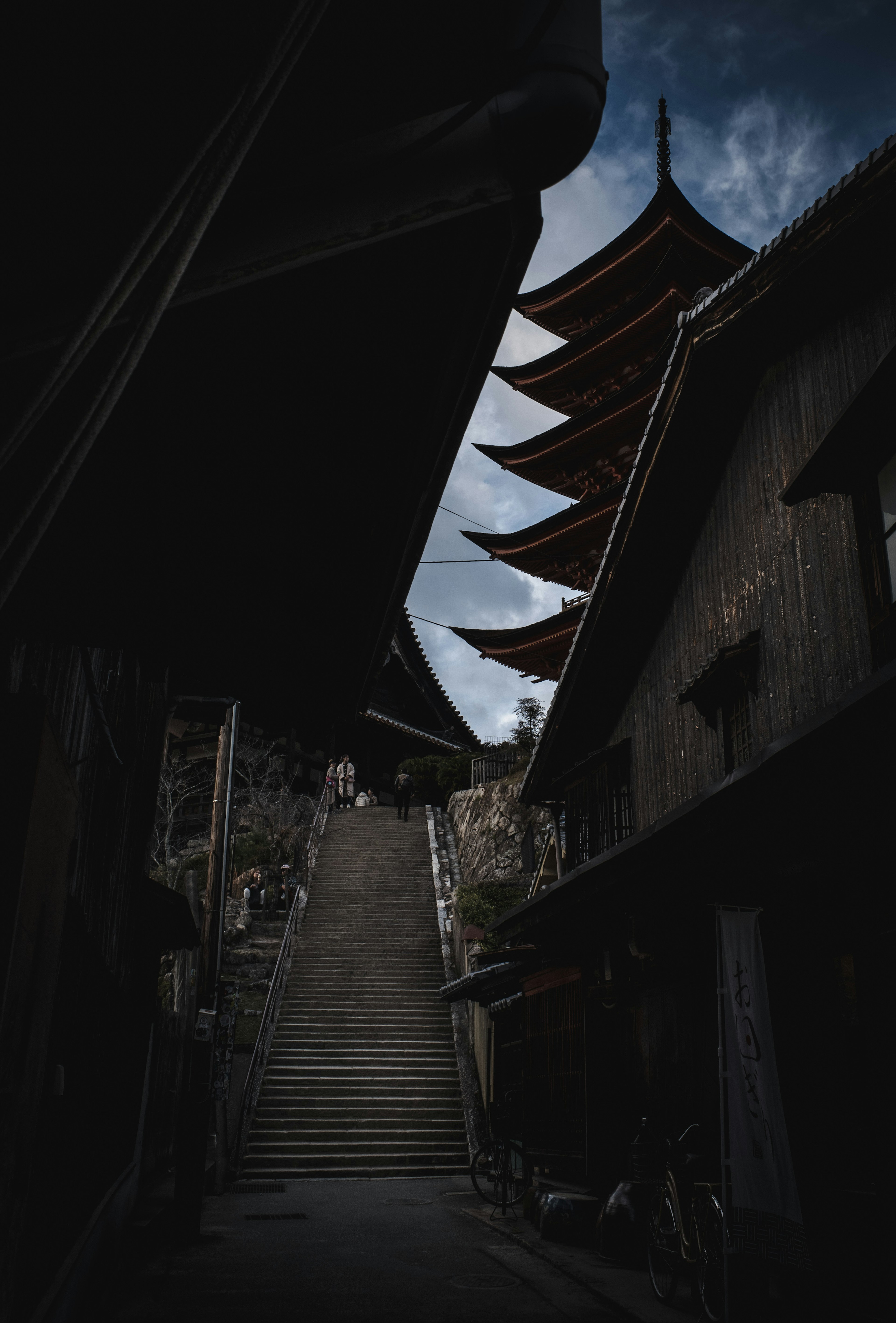 Stairs leading to a pagoda in a narrow alley