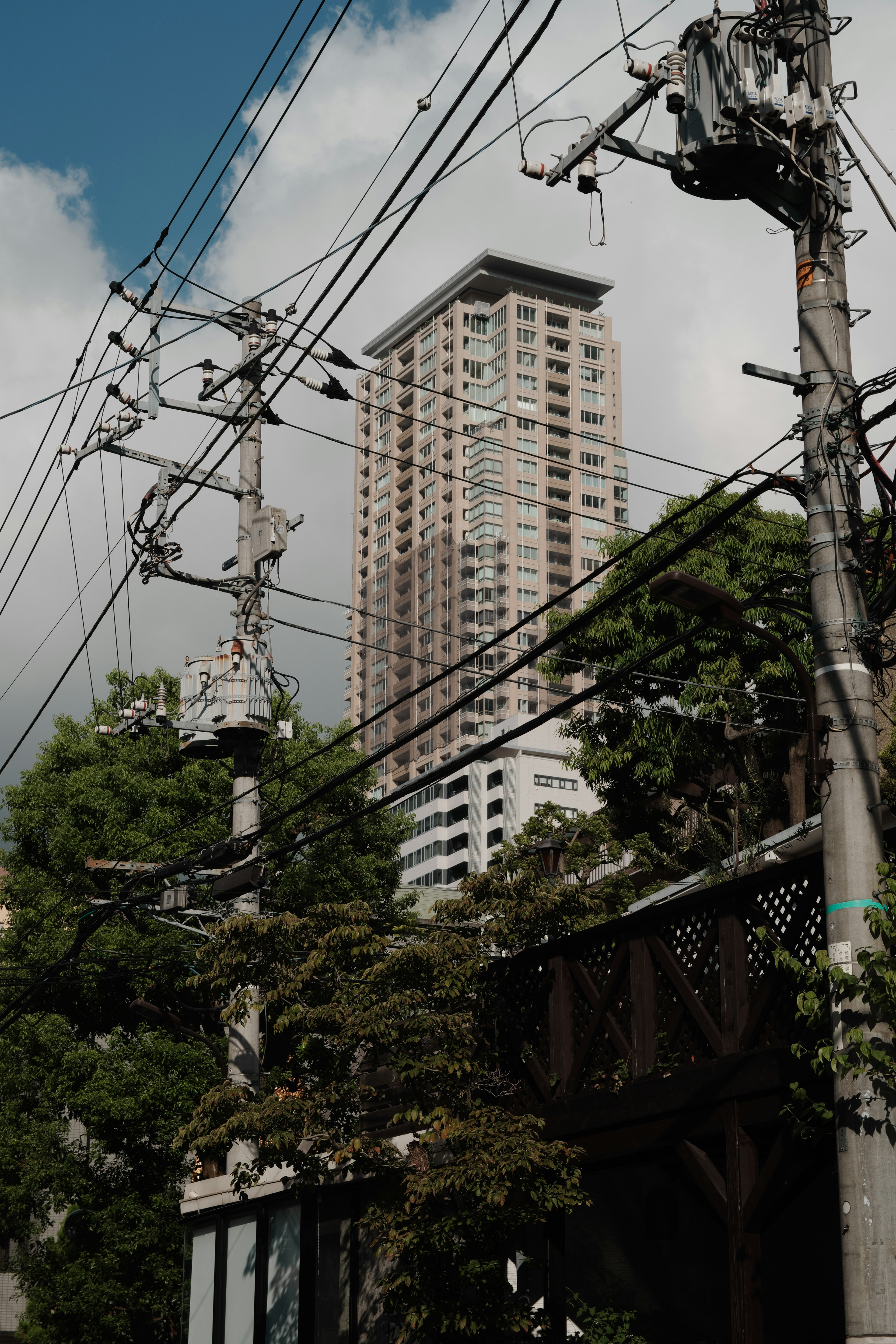 Urban scene featuring a high-rise building and power lines