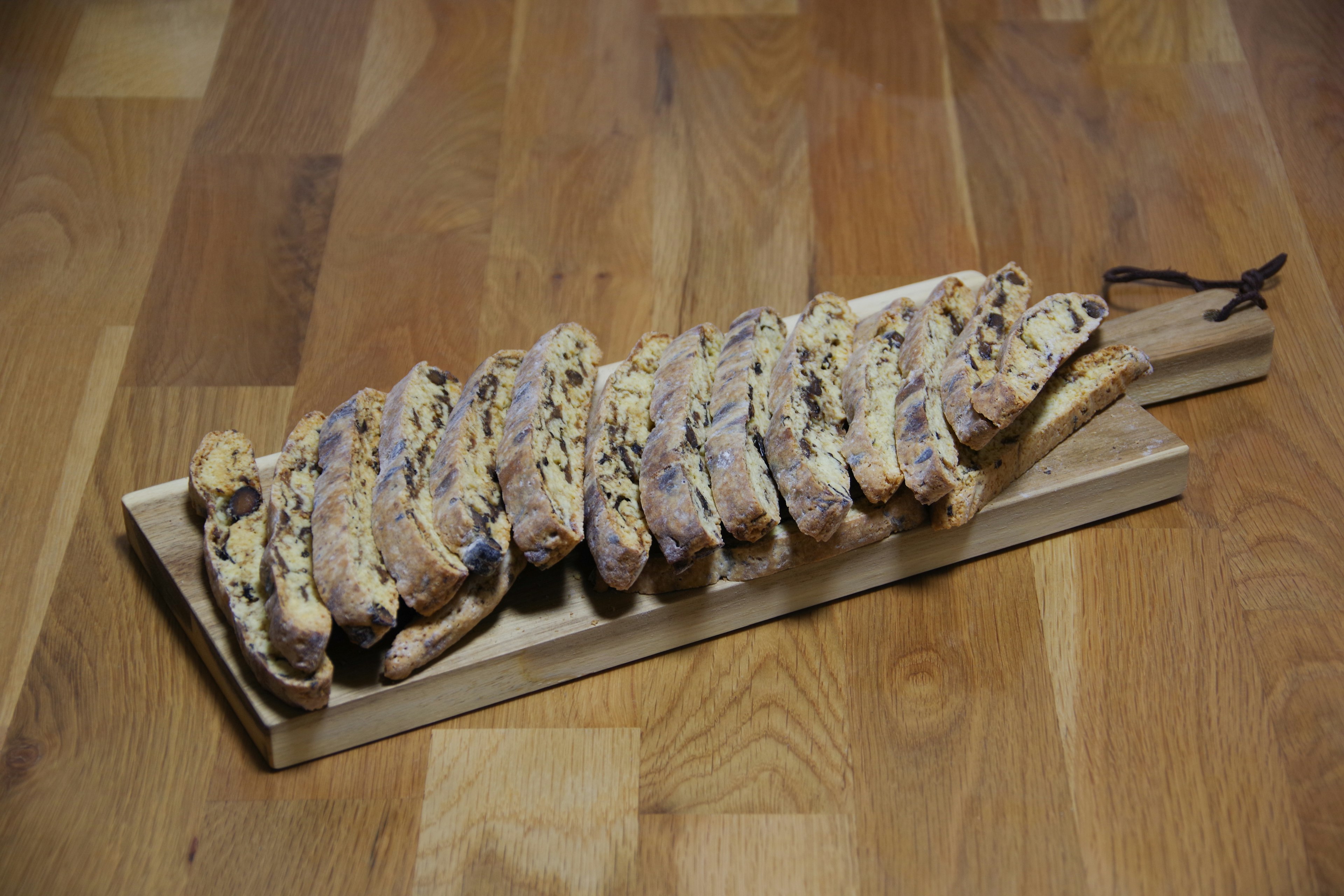 Assorted cookies arranged on a wooden platter