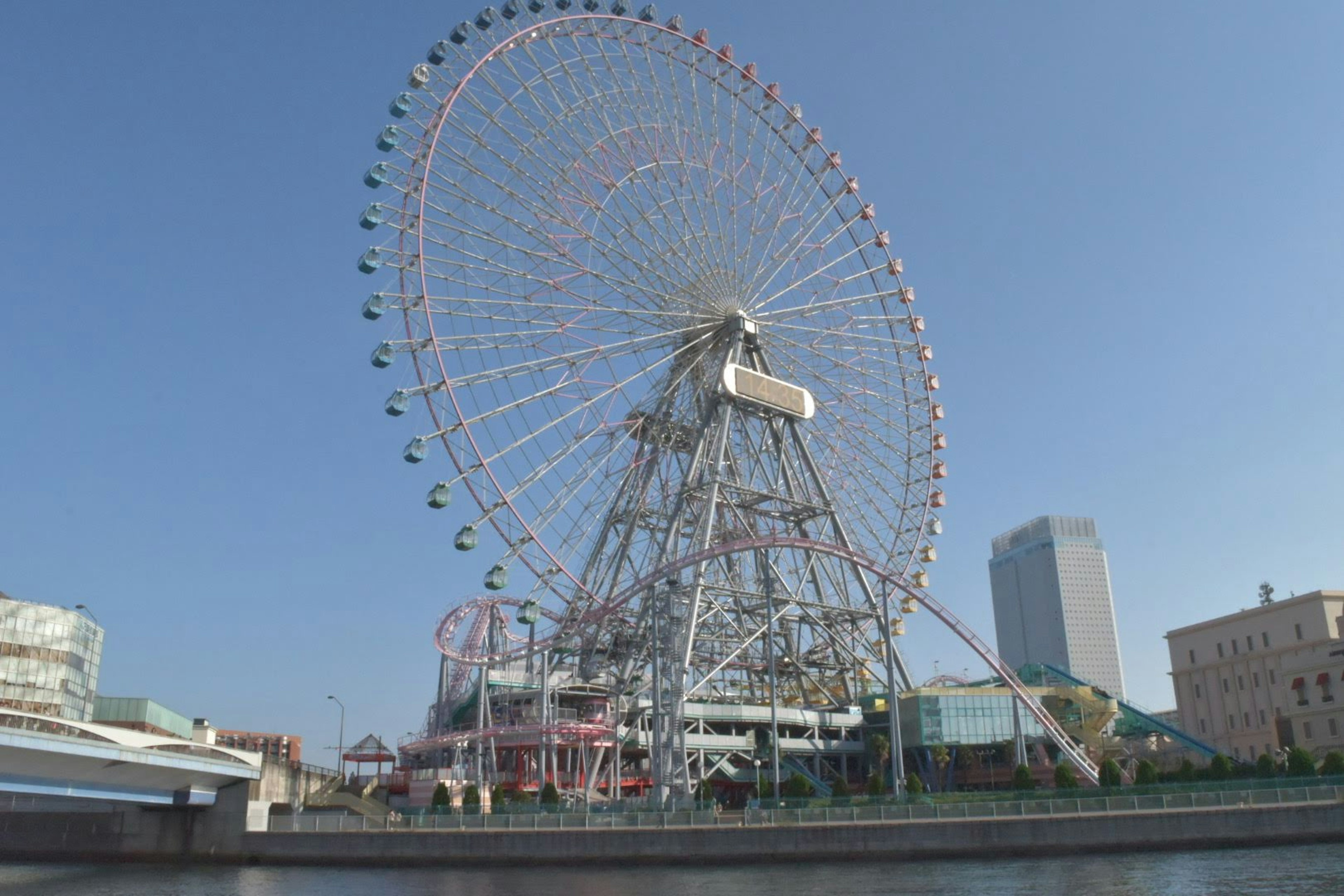 Ferris wheel against a clear blue sky