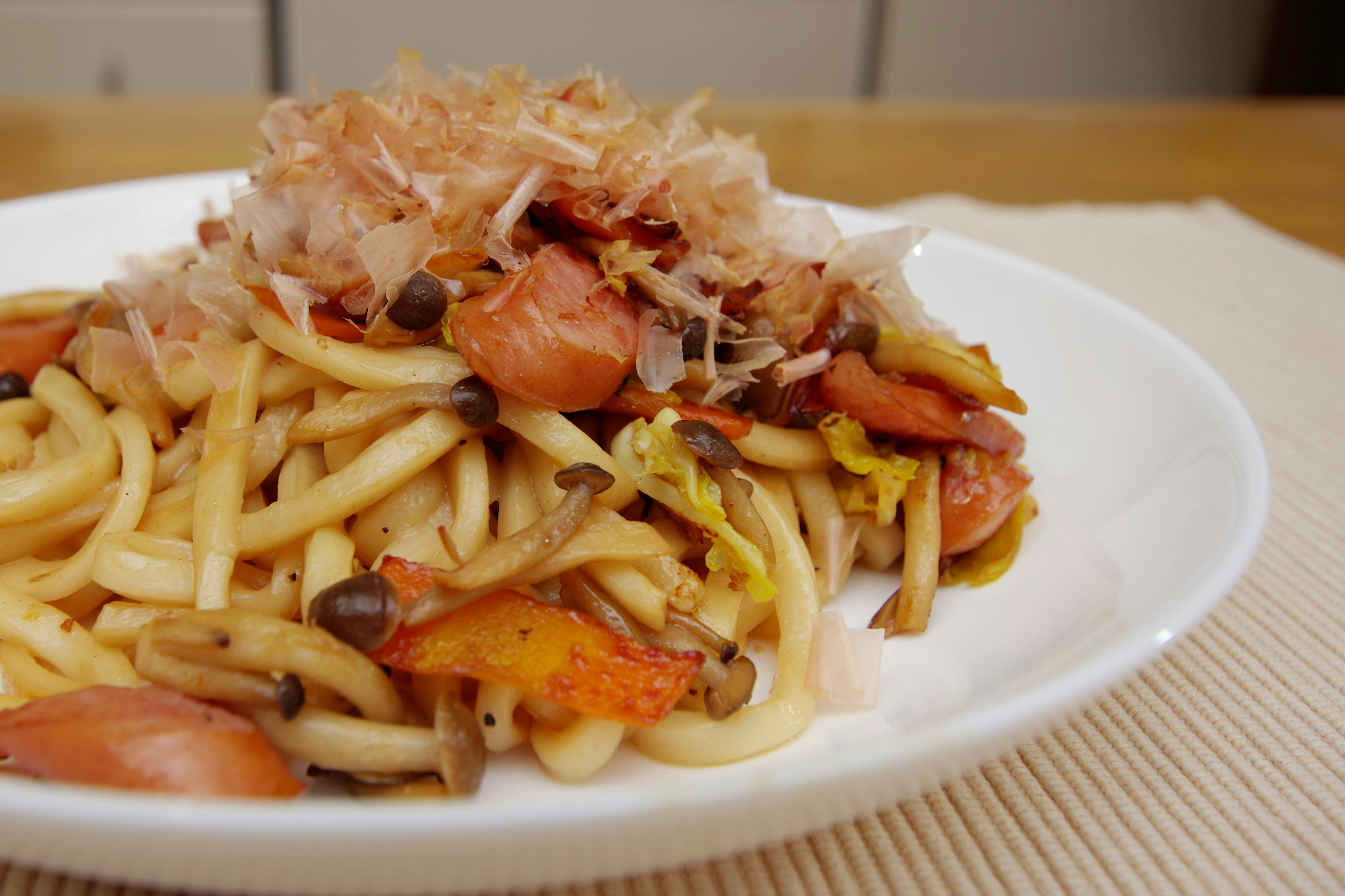 Plate of Japanese-style pasta topped with various ingredients