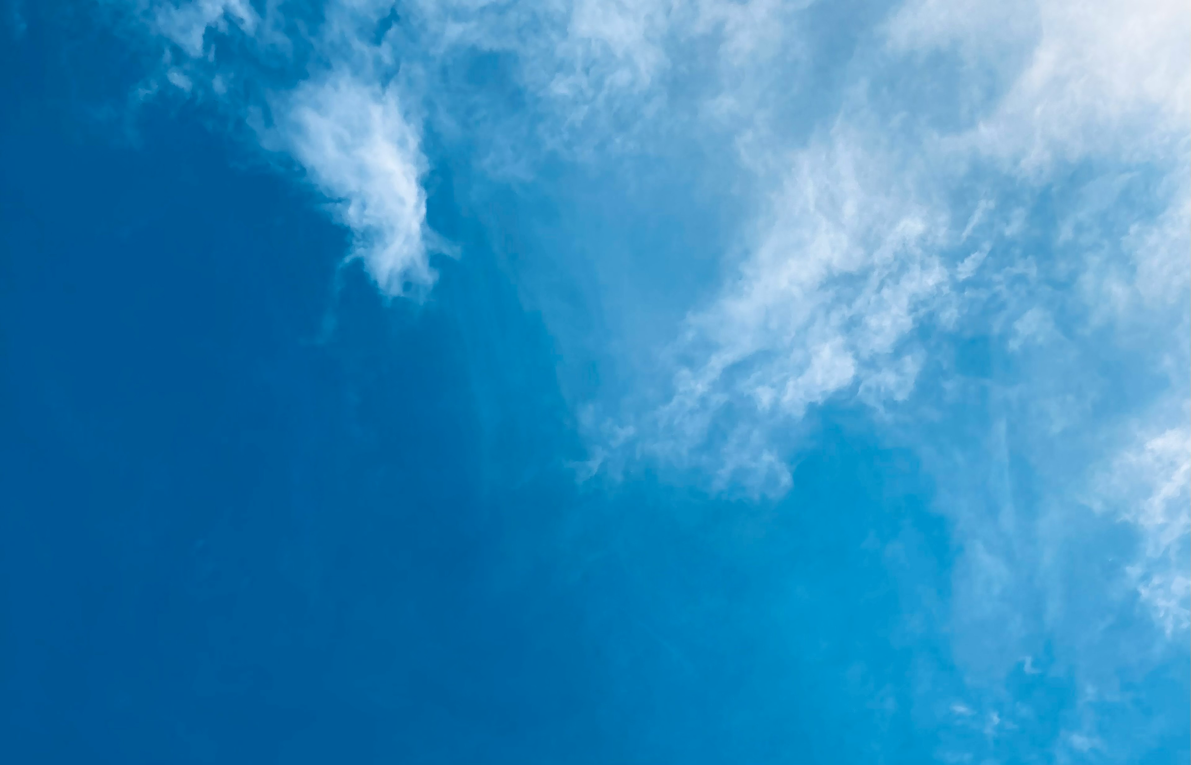 Bright blue sky with white clouds