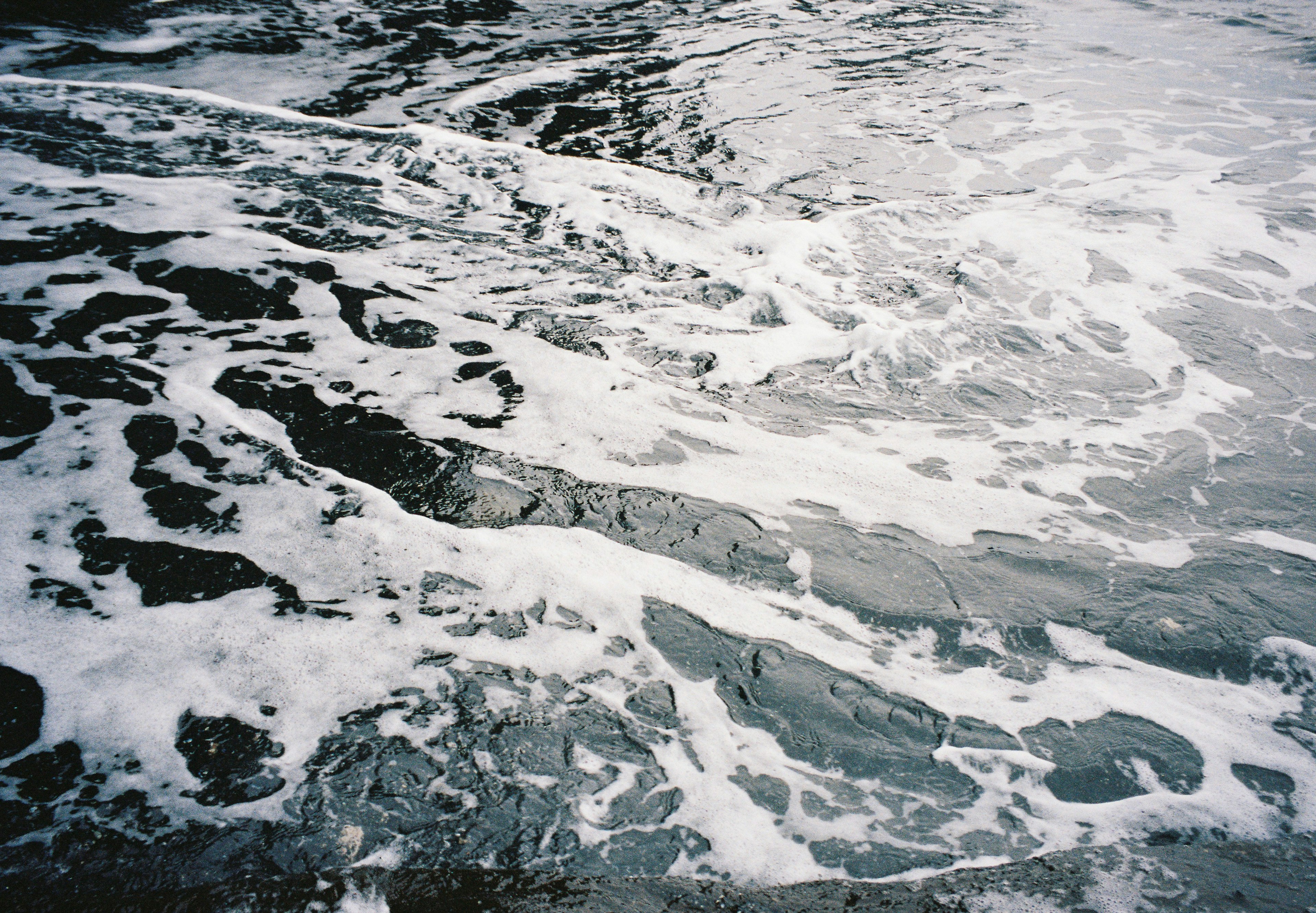 Foamy ocean surface with waves