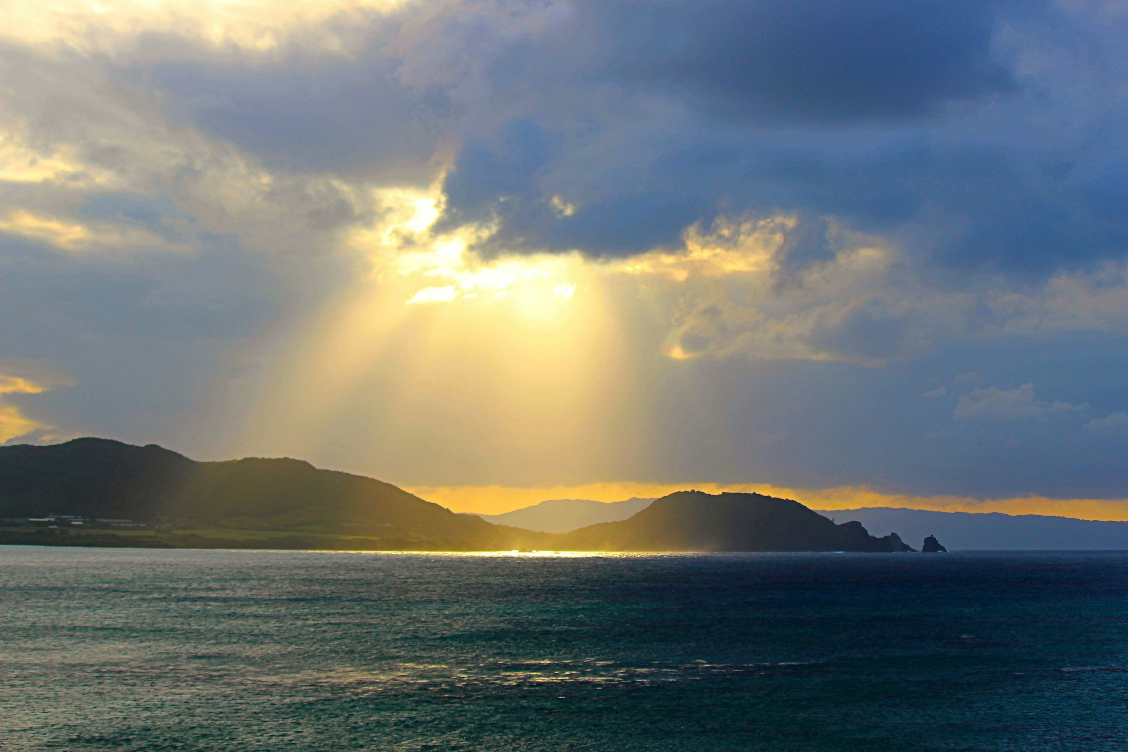 Beautiful landscape of sea and mountains with rays of light