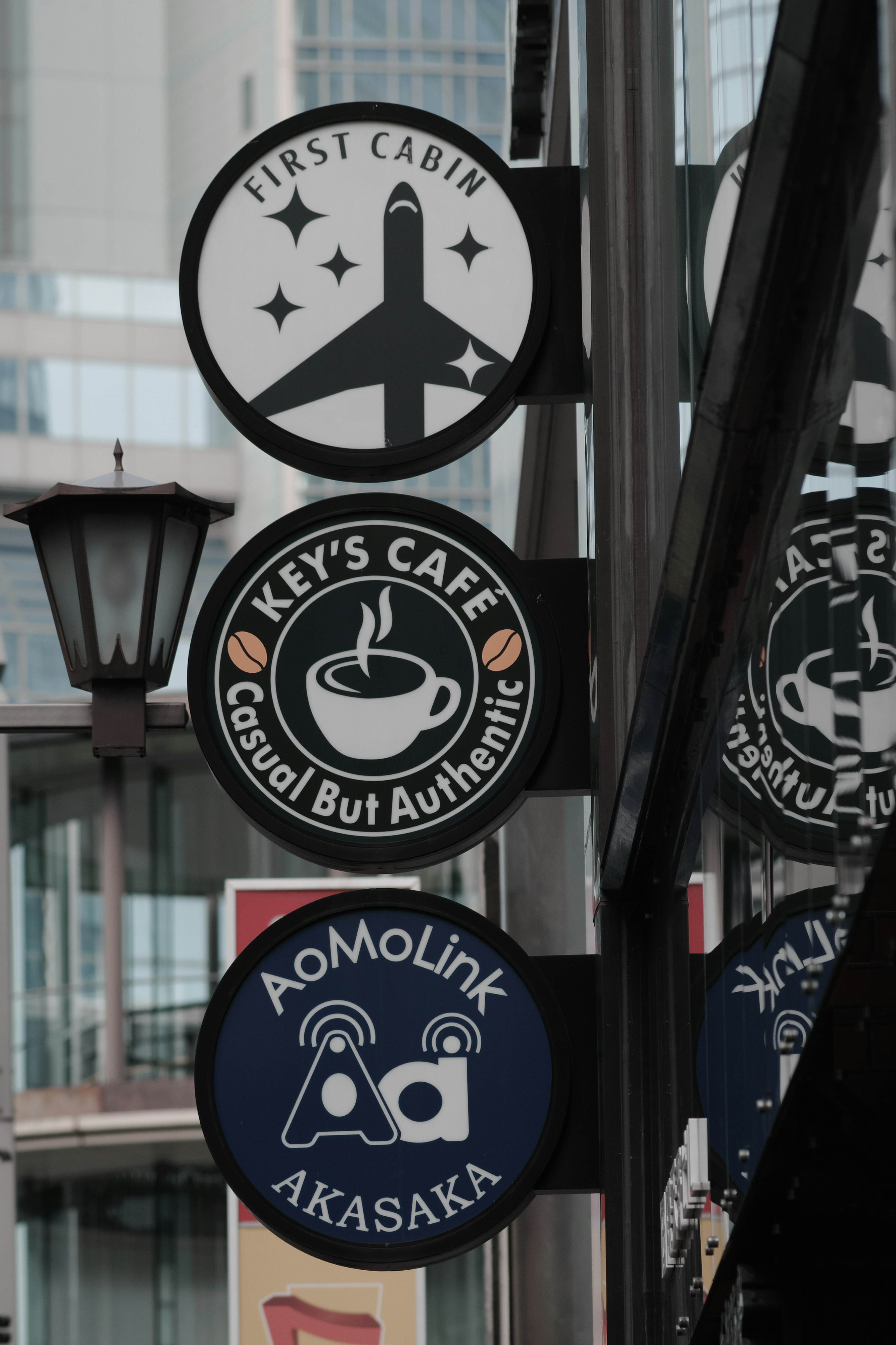 Cafe signs featuring a plane symbol and a coffee cup