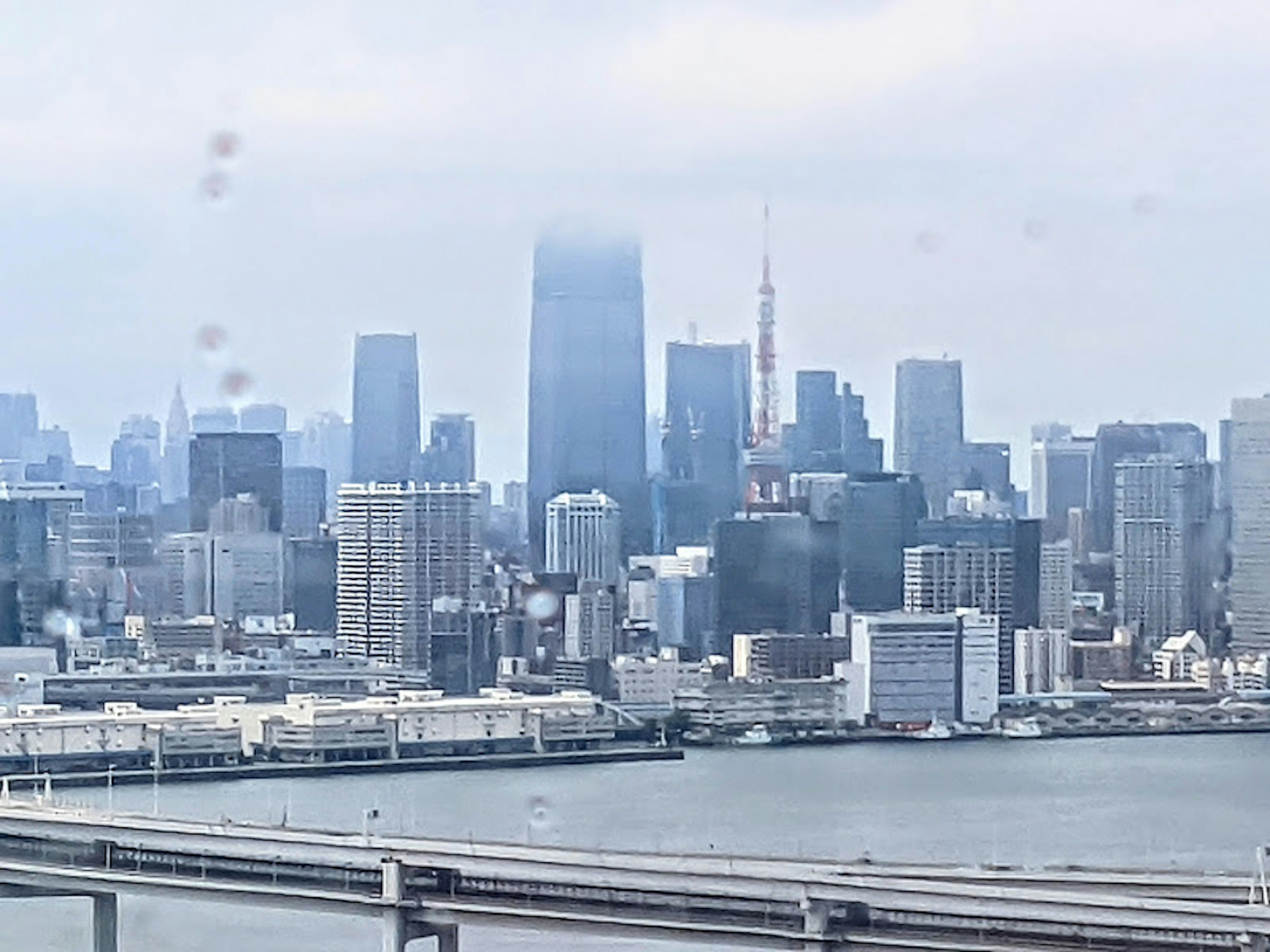 Foggy city skyline with a river view