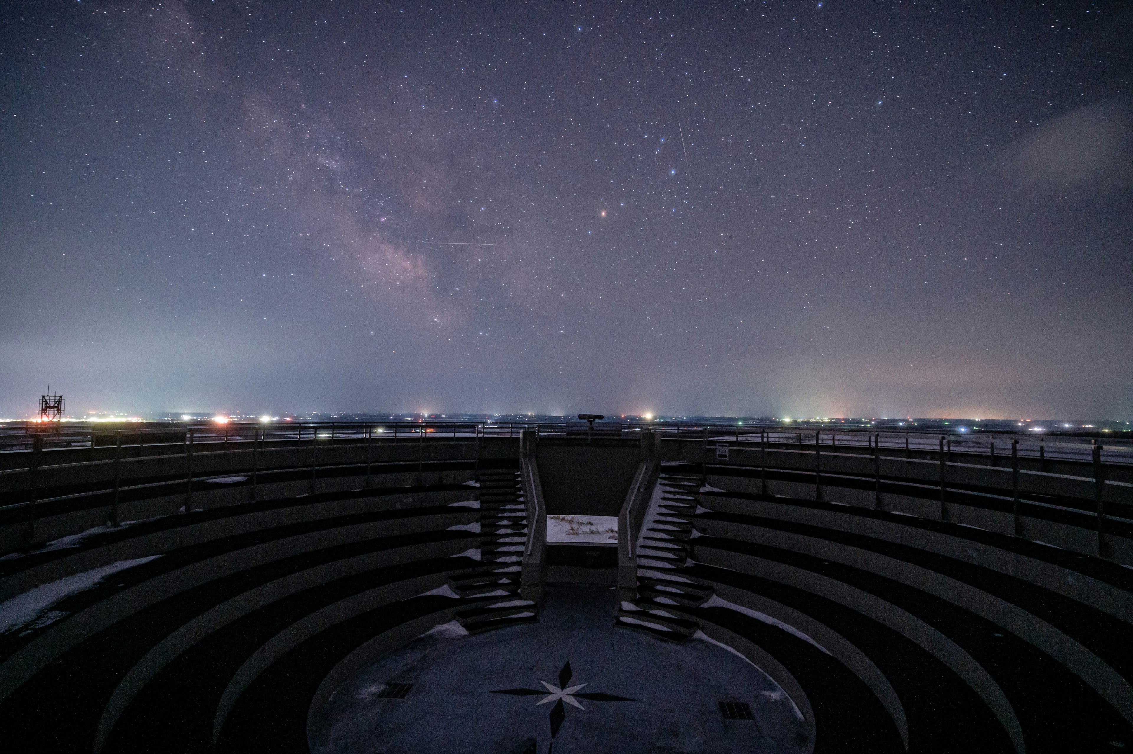 Aerial view featuring a starry night sky and circular seating area