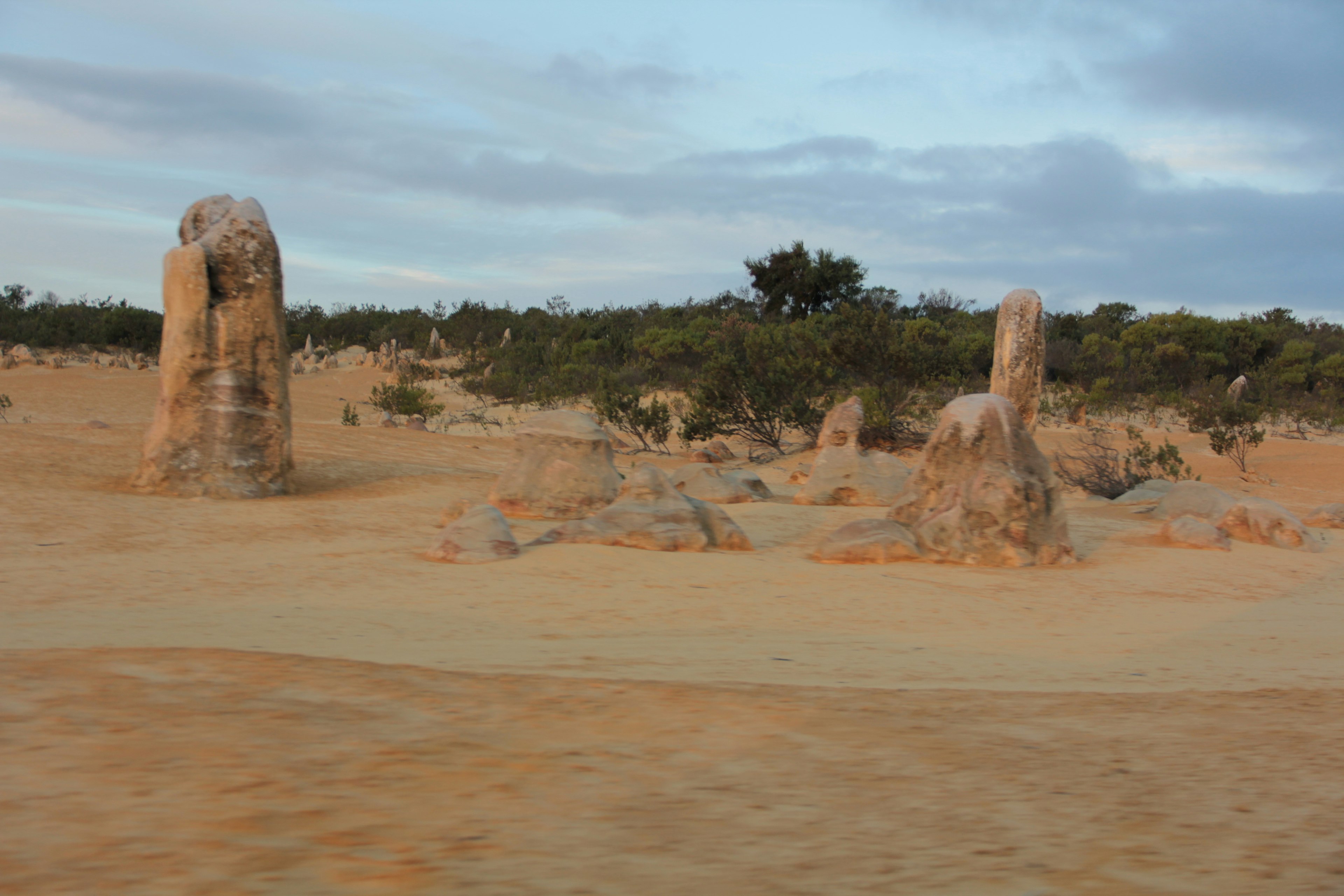 Landscape of large rock formations in a dry desert setting