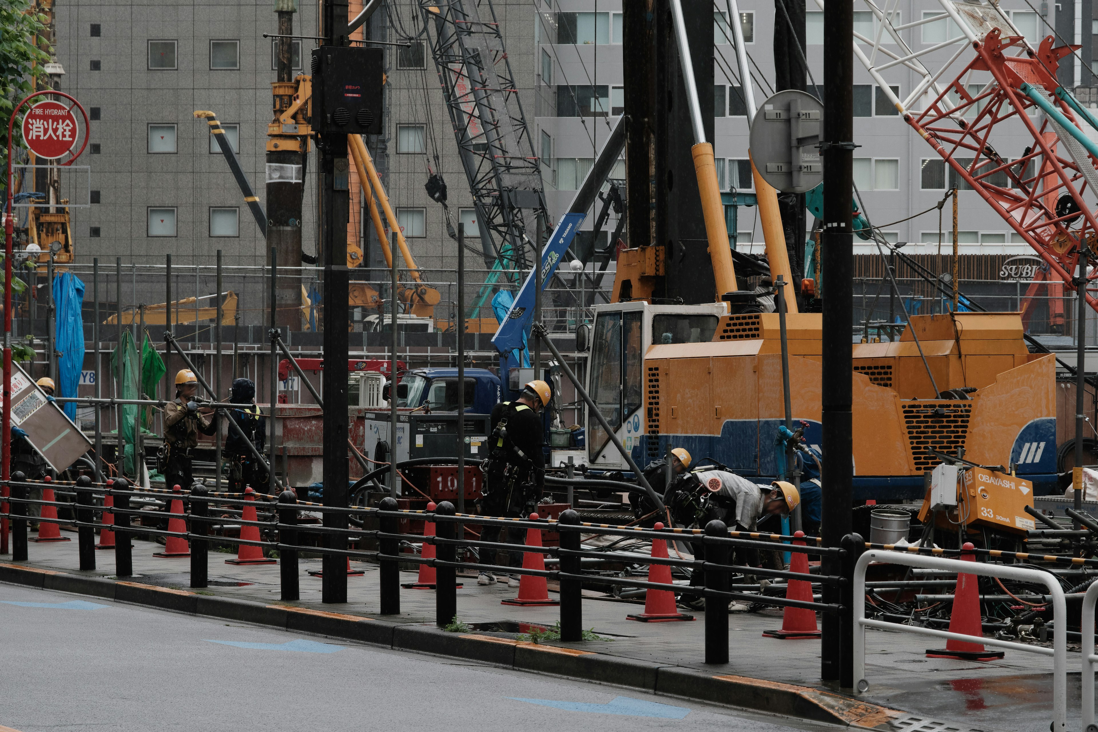 Construction site with workers and heavy machinery