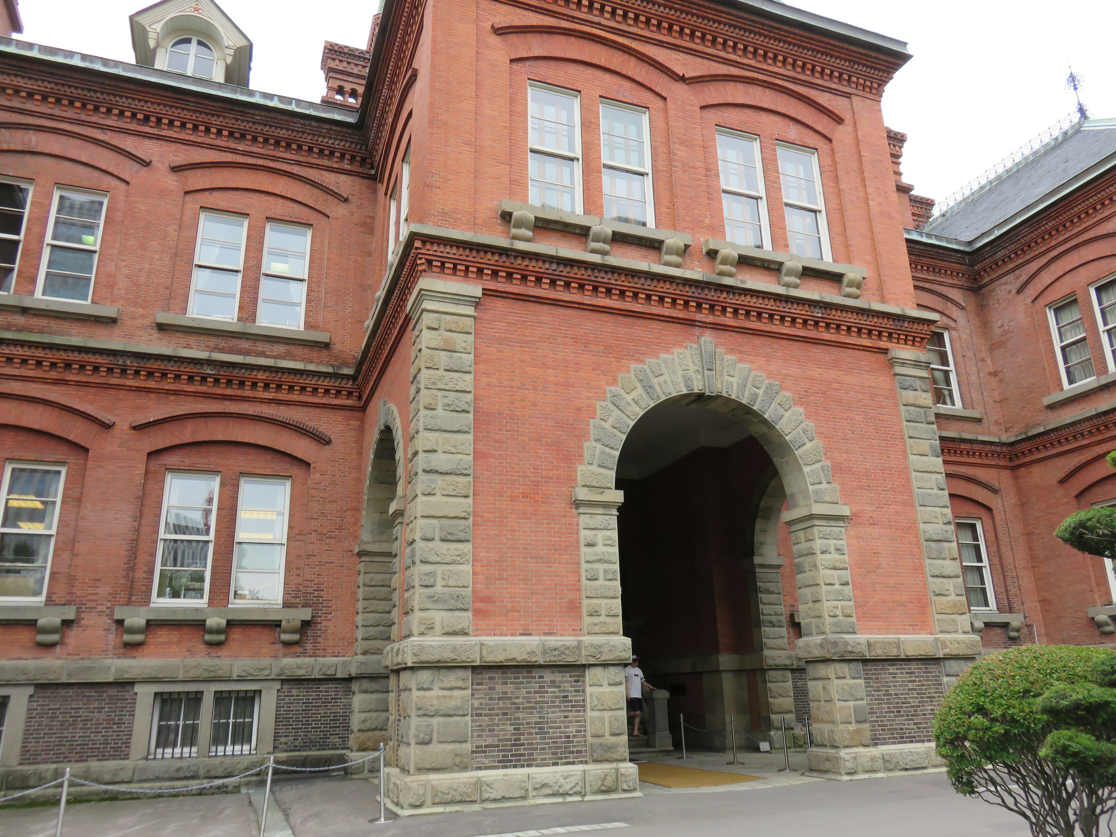 Red brick building with an arched entrance