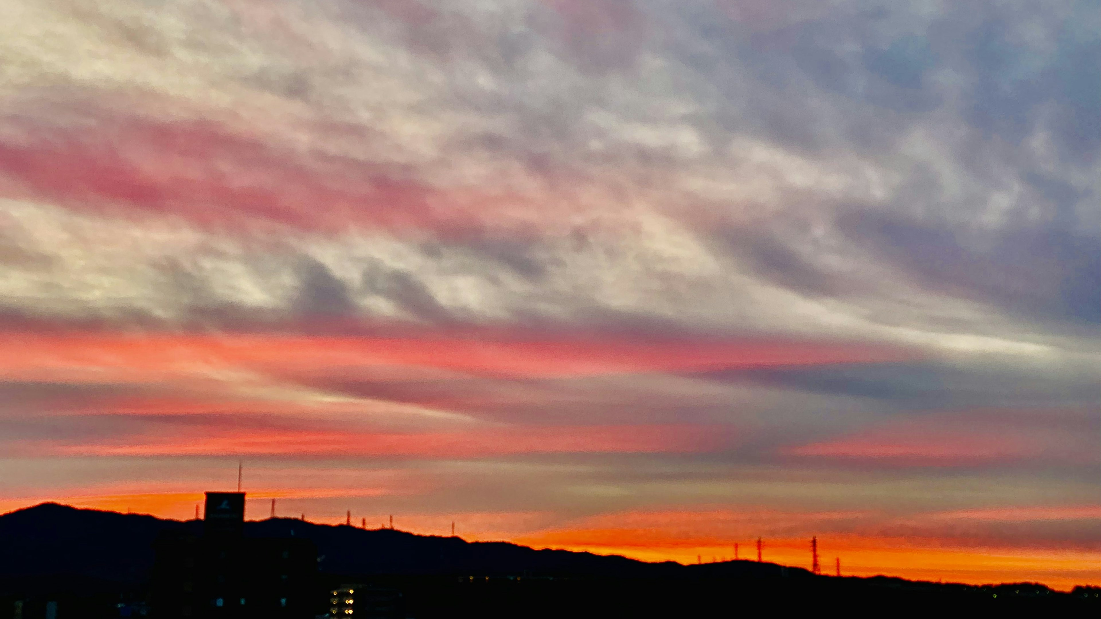 Stunning sunset sky with silhouetted mountains