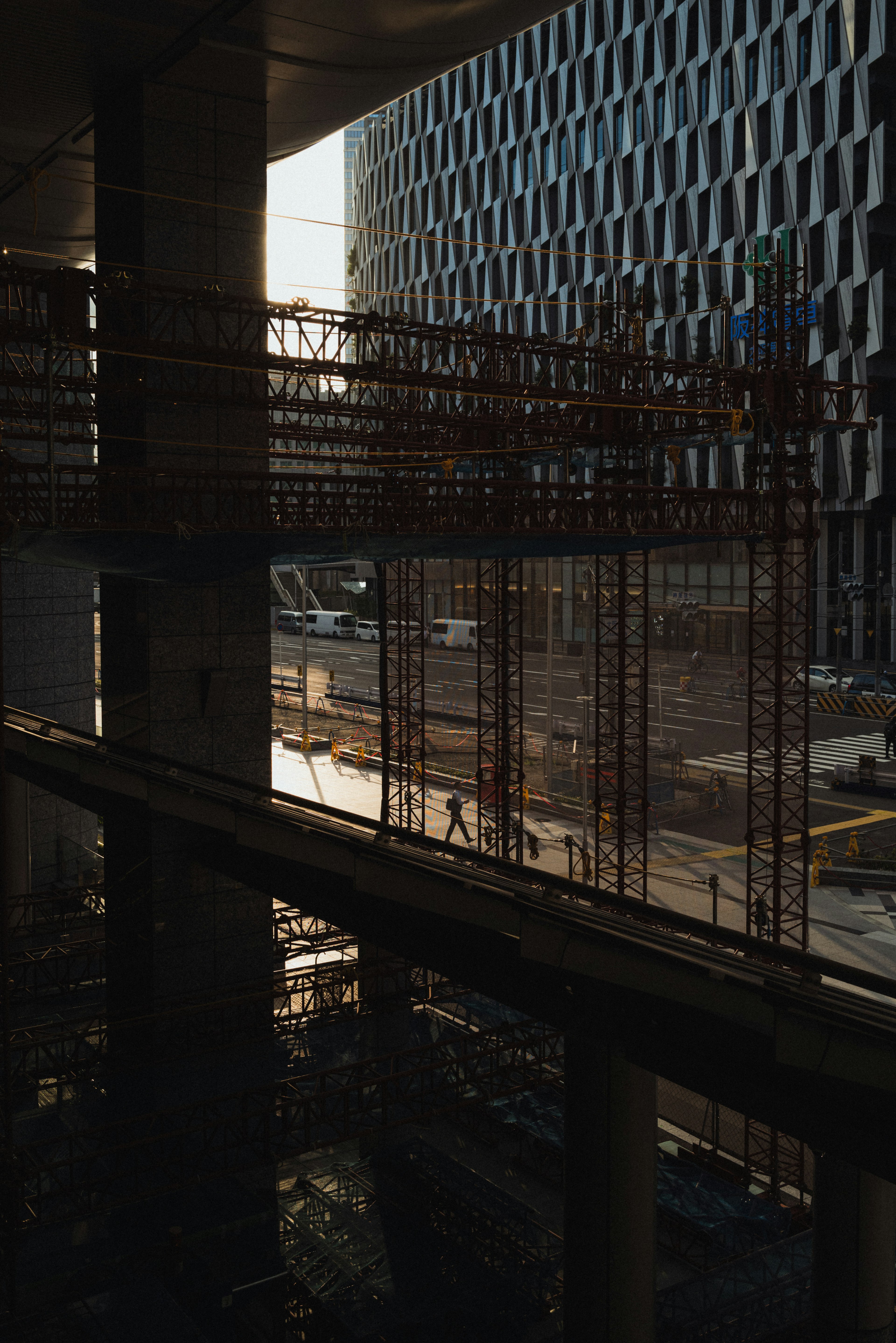 Construction site view with scaffolding and sunset