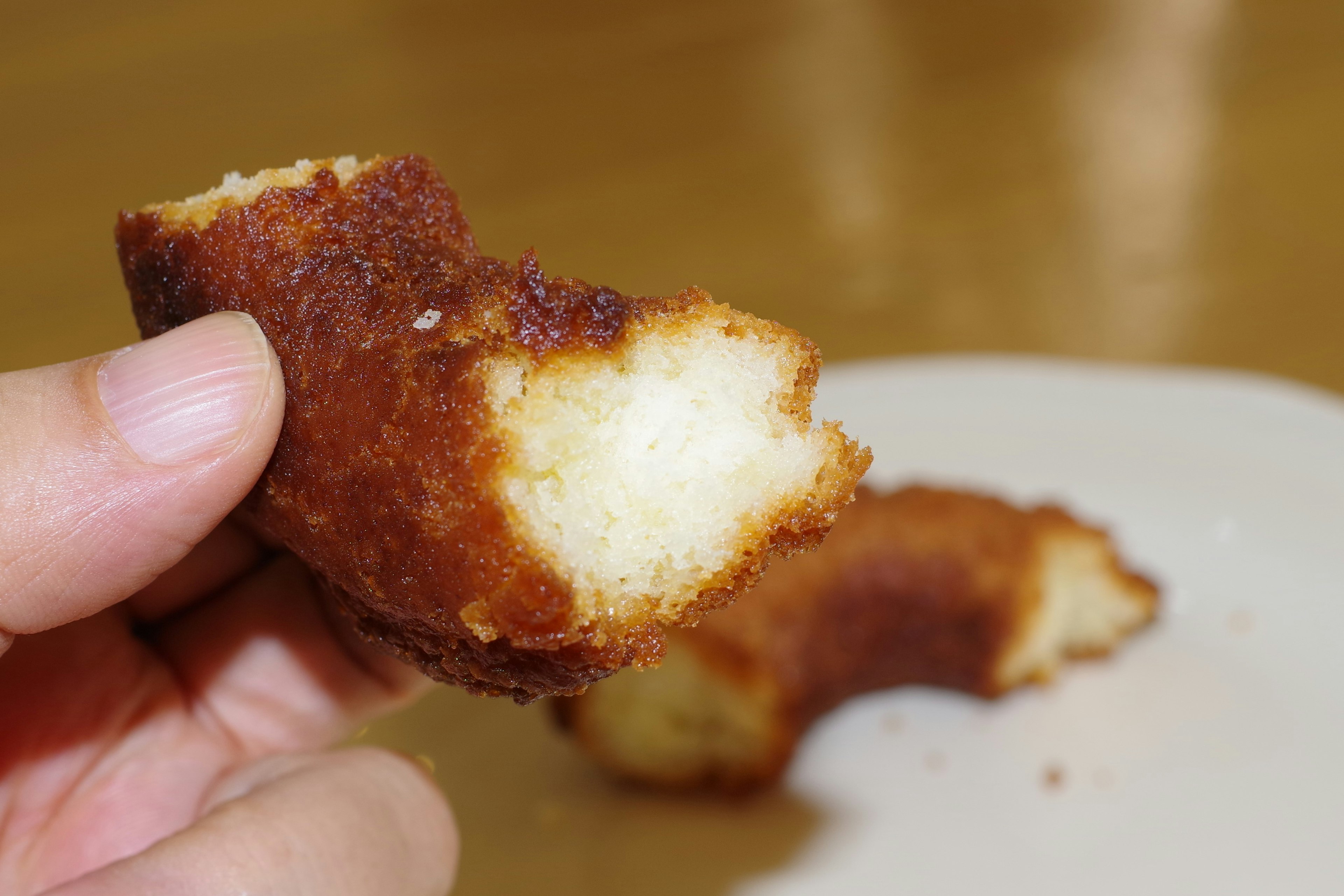 Image of a partially bitten baked treat held in hand