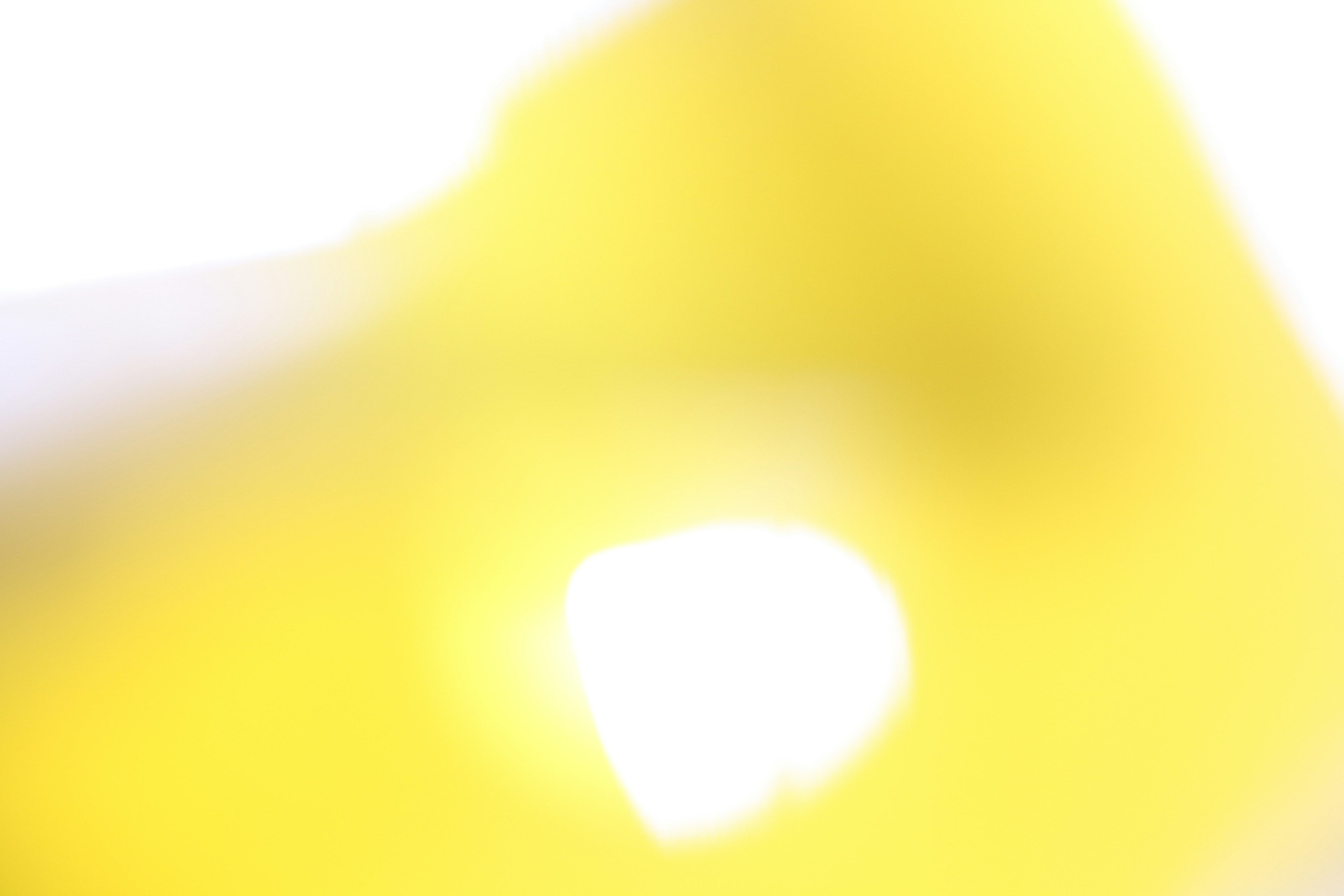 Blurred yellow light with an abstract white background