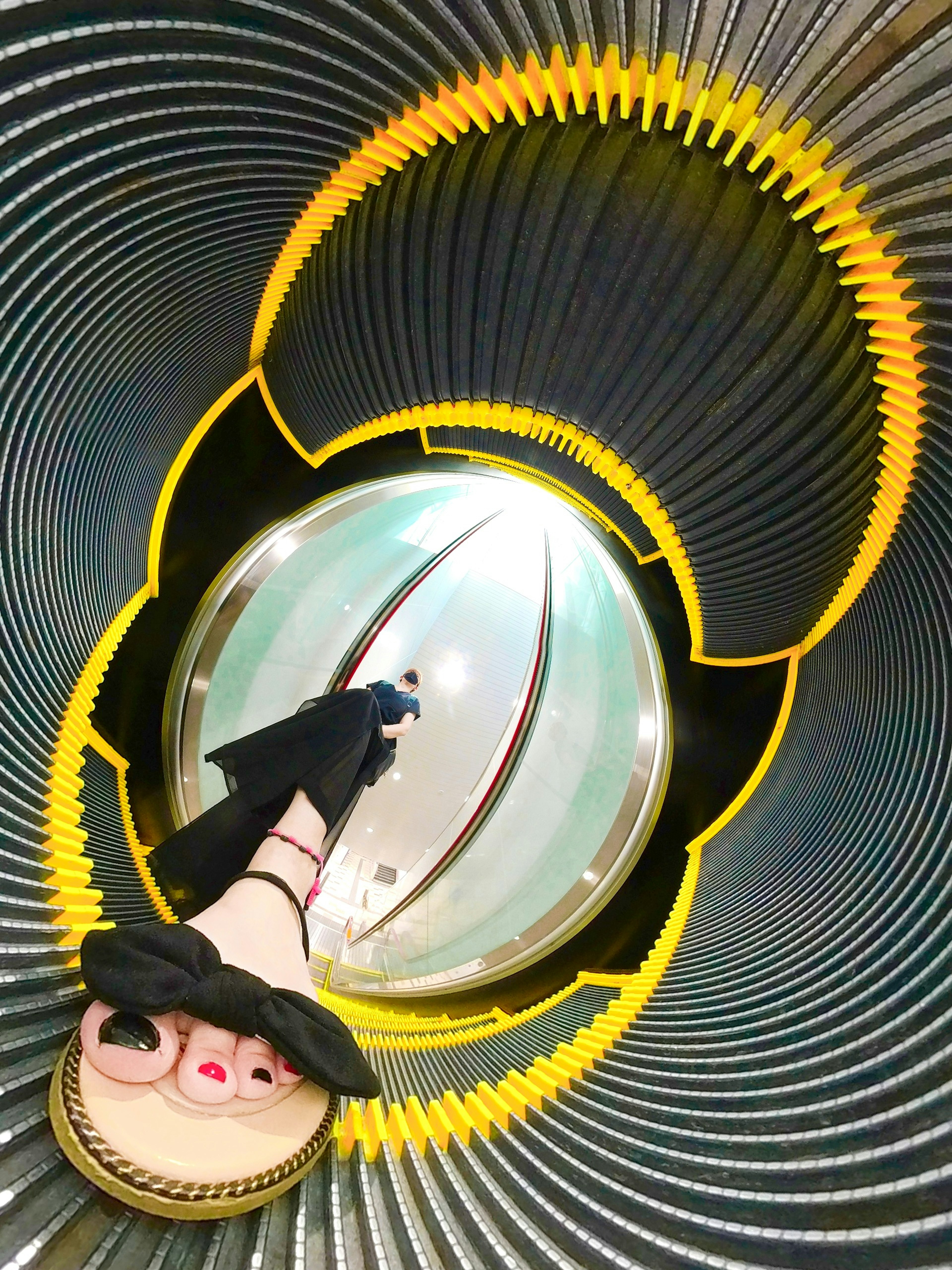 Woman's feet standing in a circular structure with flowing design