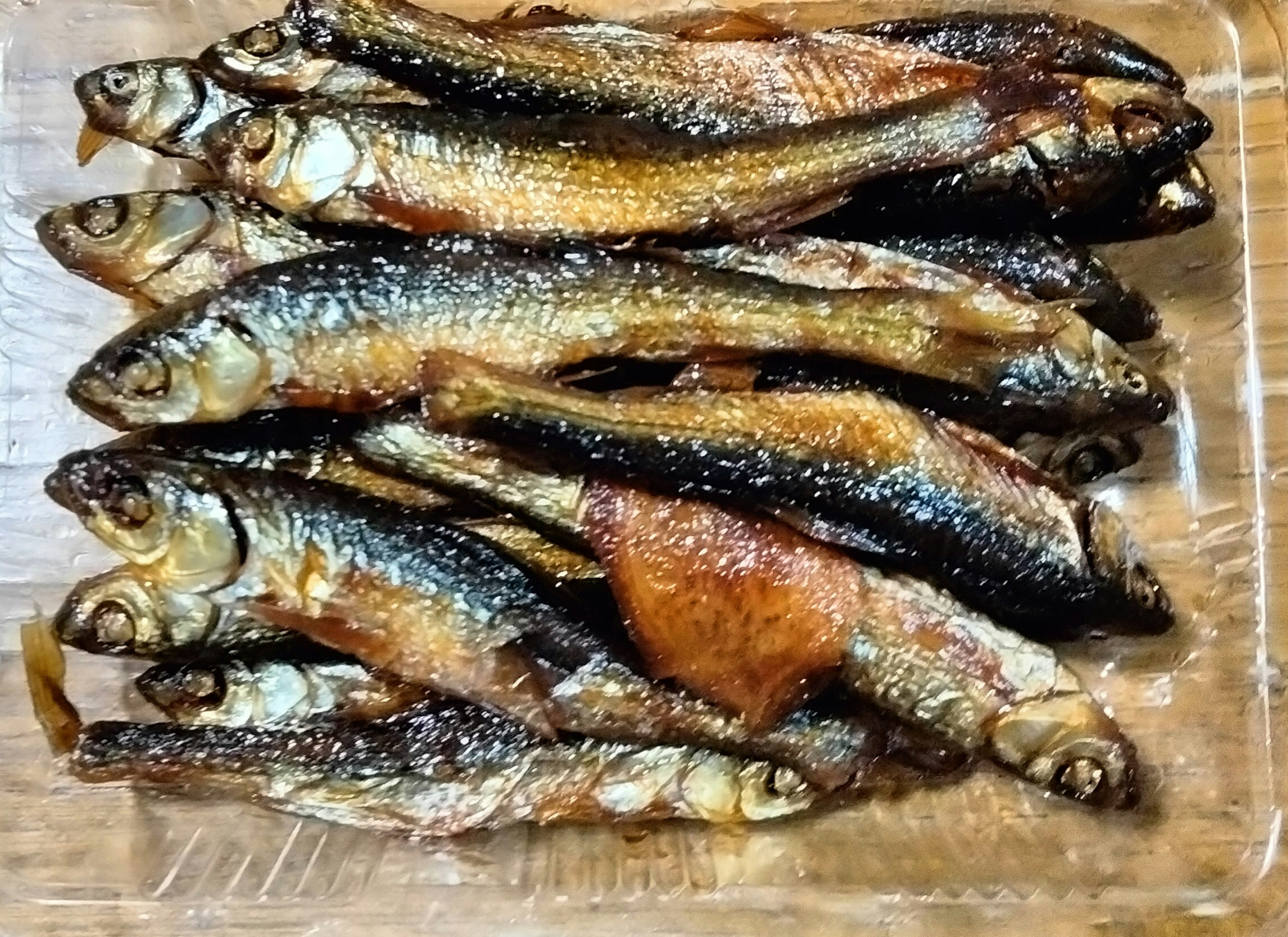 A plate of grilled fish arranged neatly