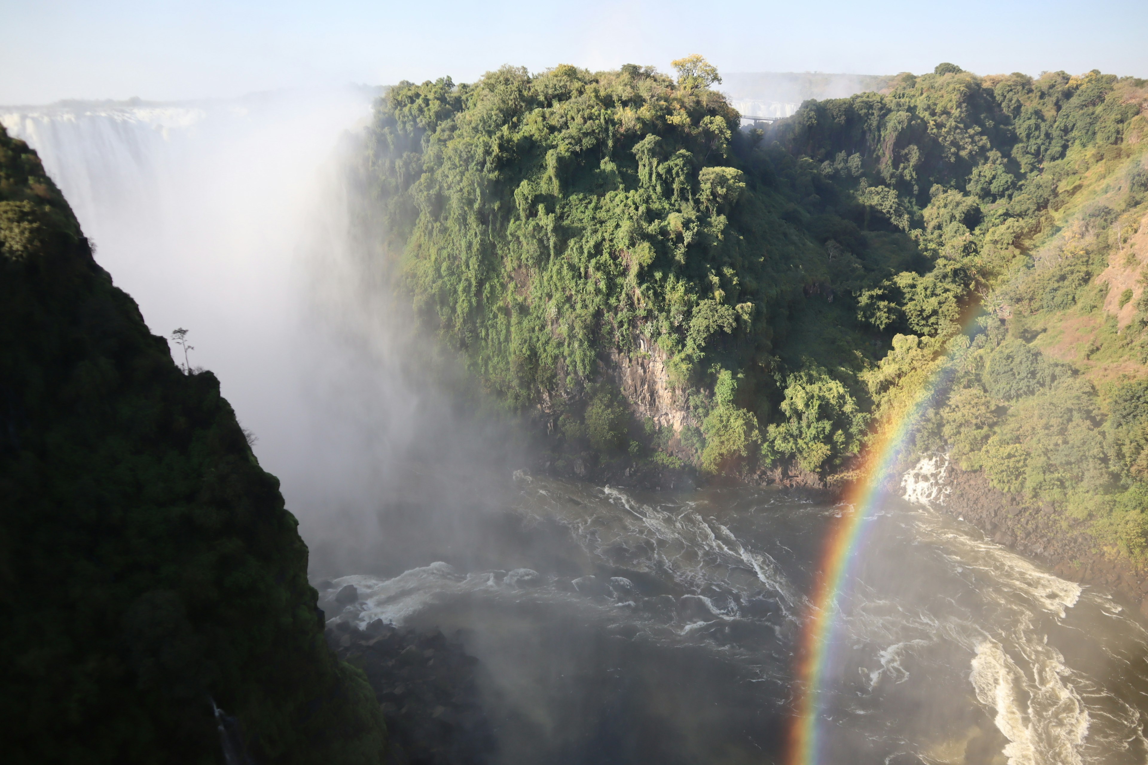 Breathtaking view of Iguazu Falls with a rainbow