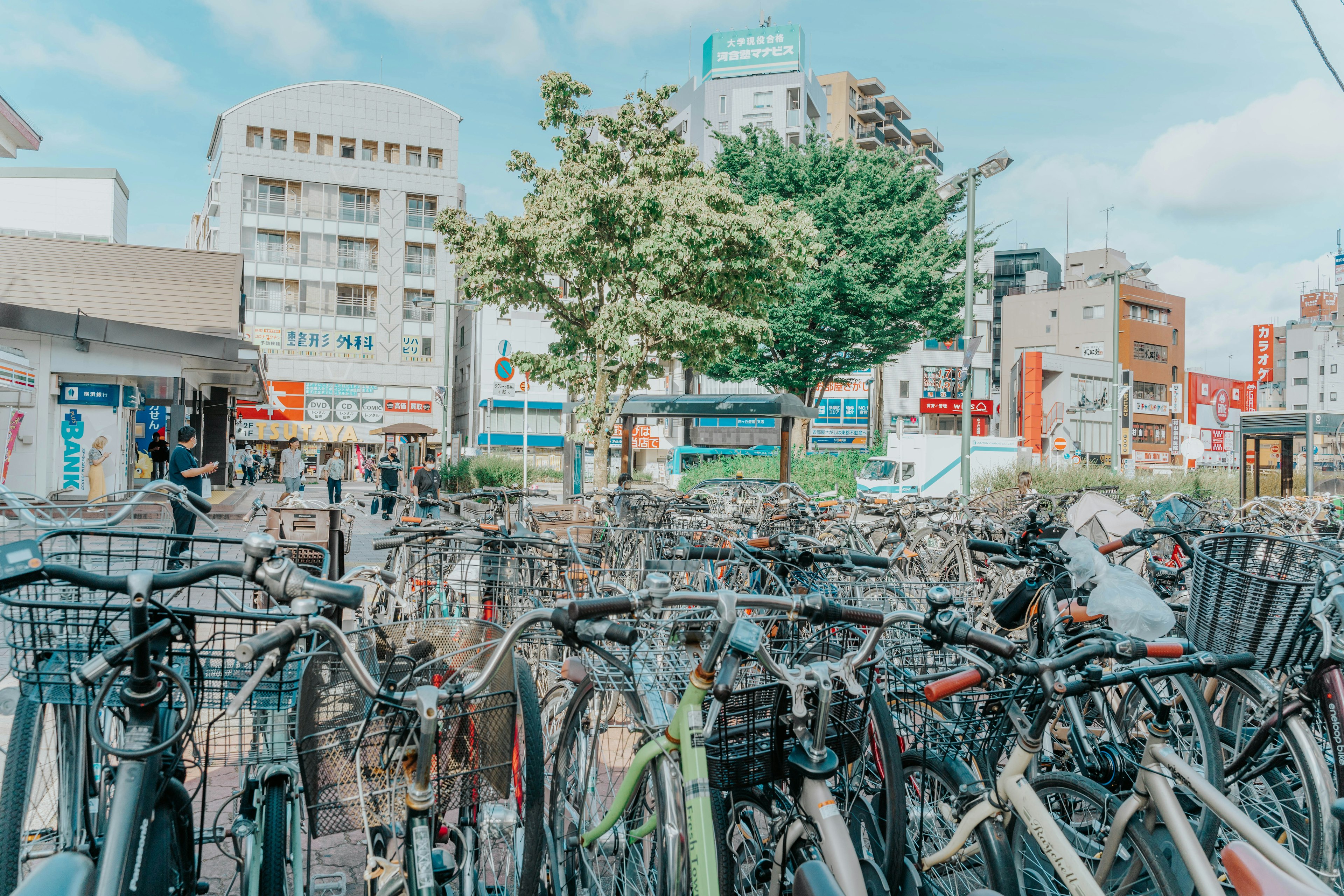 A busy urban scene filled with parked bicycles