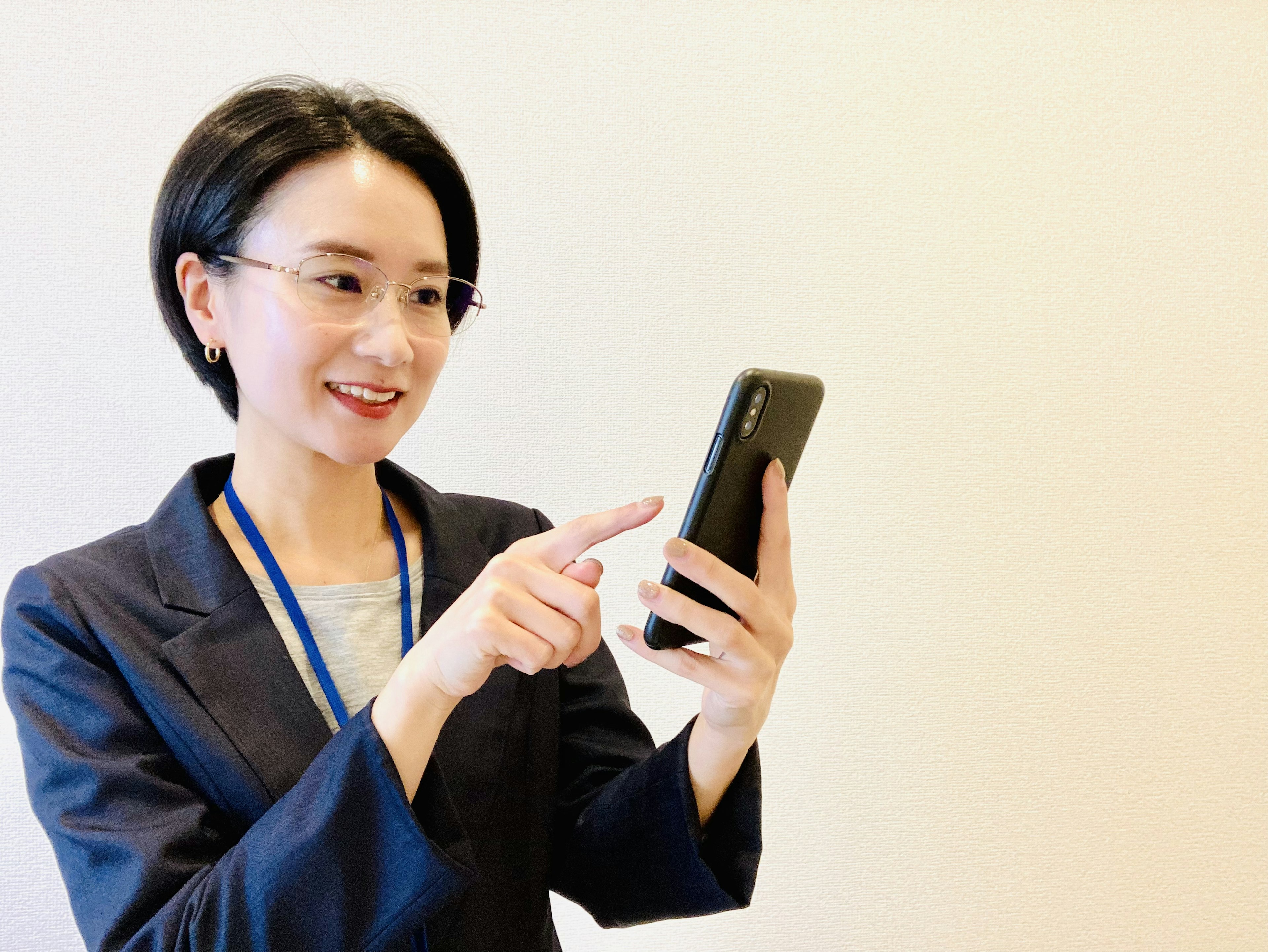 Businesswoman interacting with smartphone