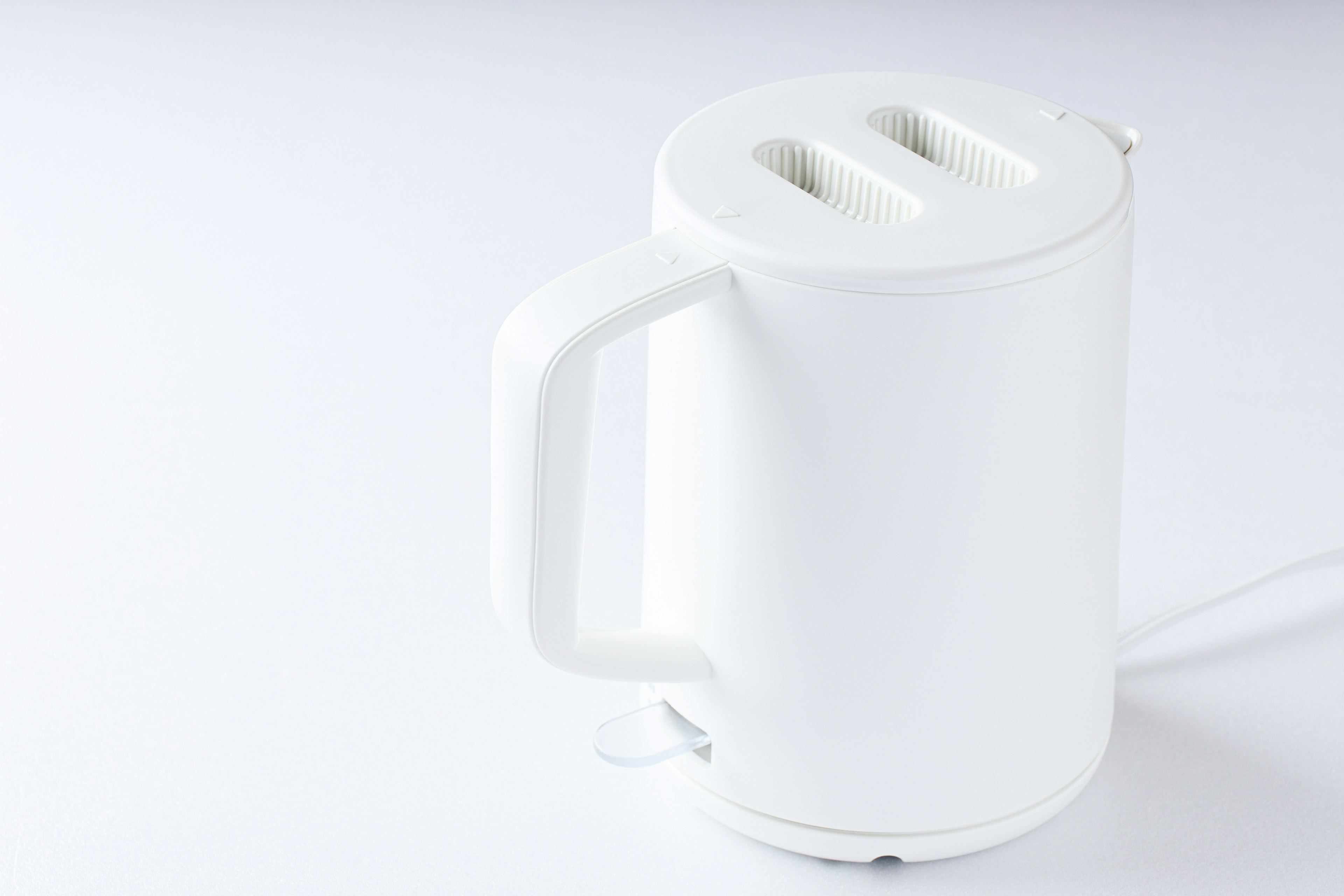 White toaster with a simple design and handle