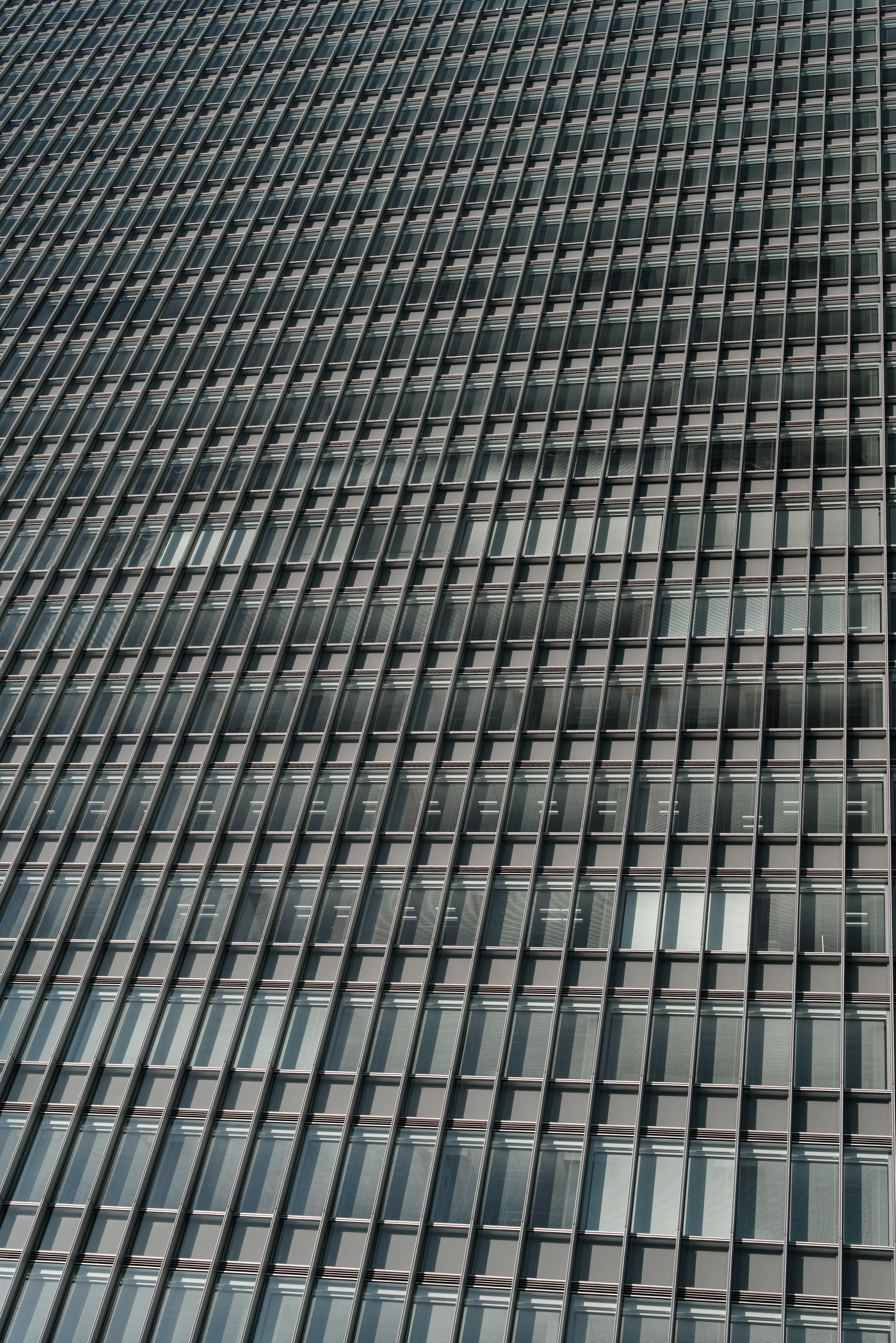 Close-up of a modern building facade featuring a grid pattern