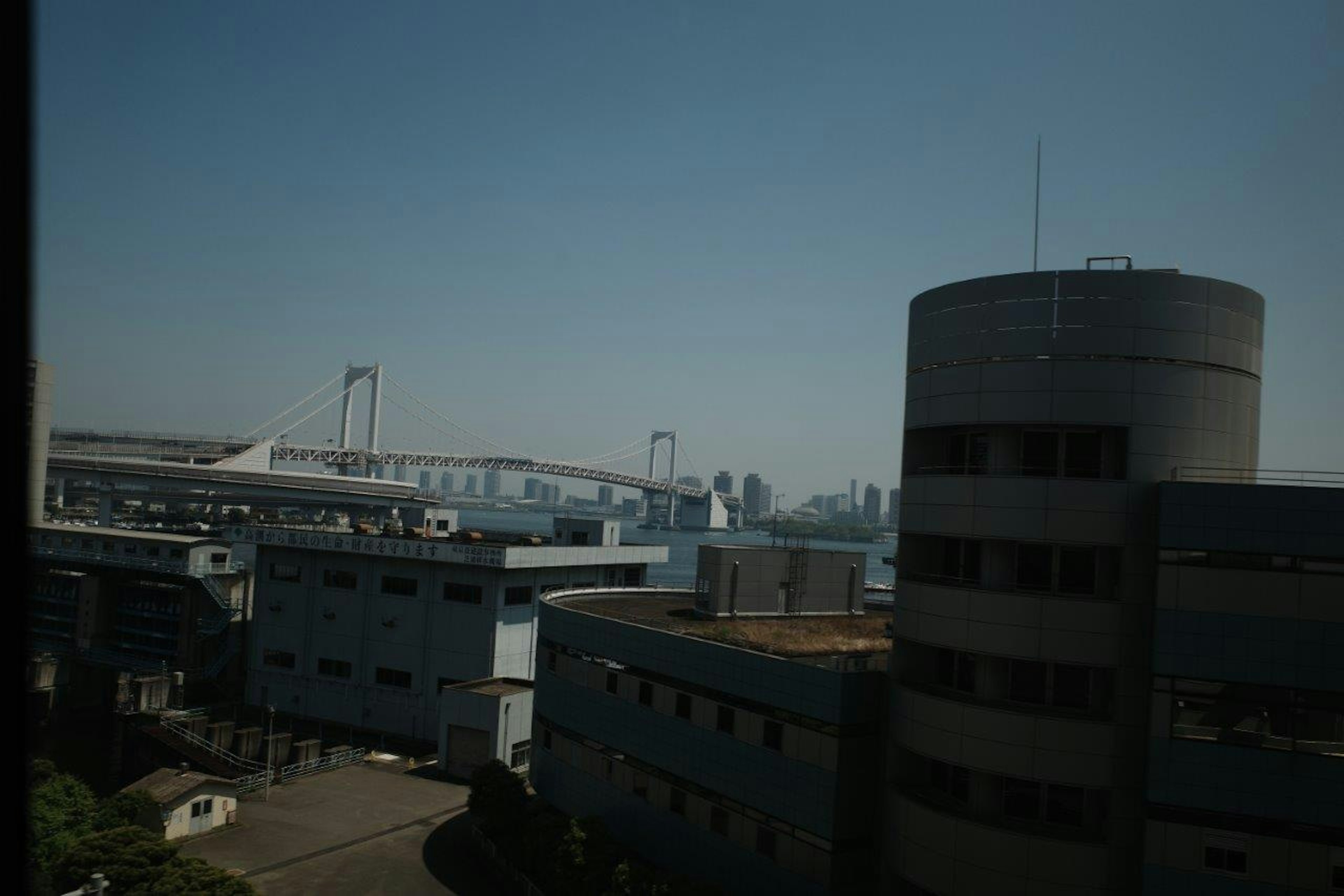 View of waterfront buildings and Rainbow Bridge