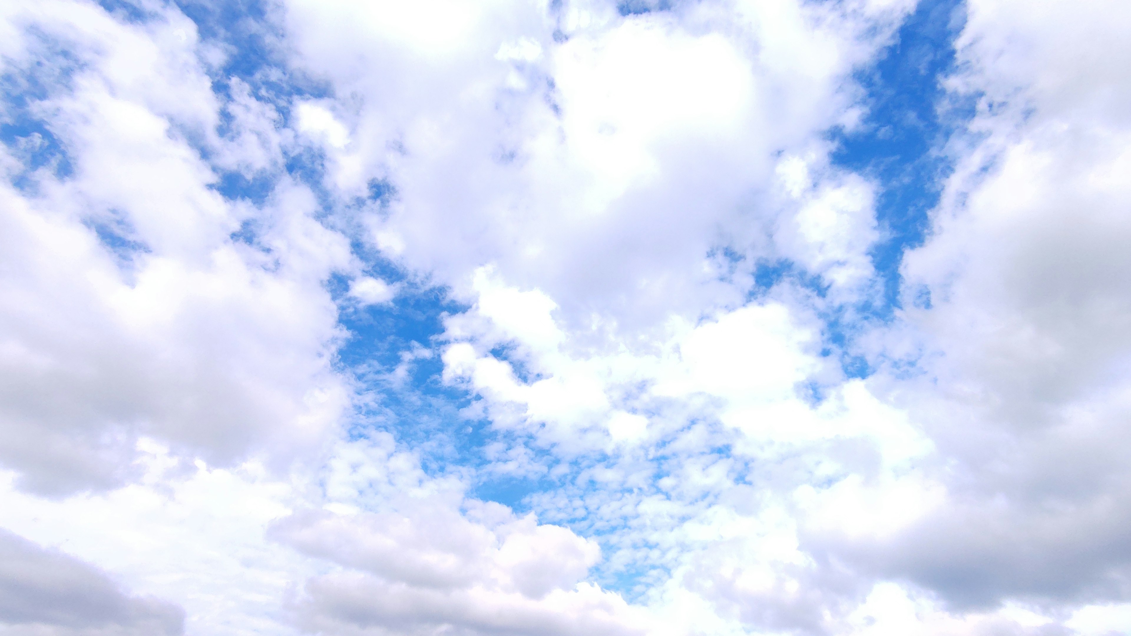 Blue sky with fluffy white clouds