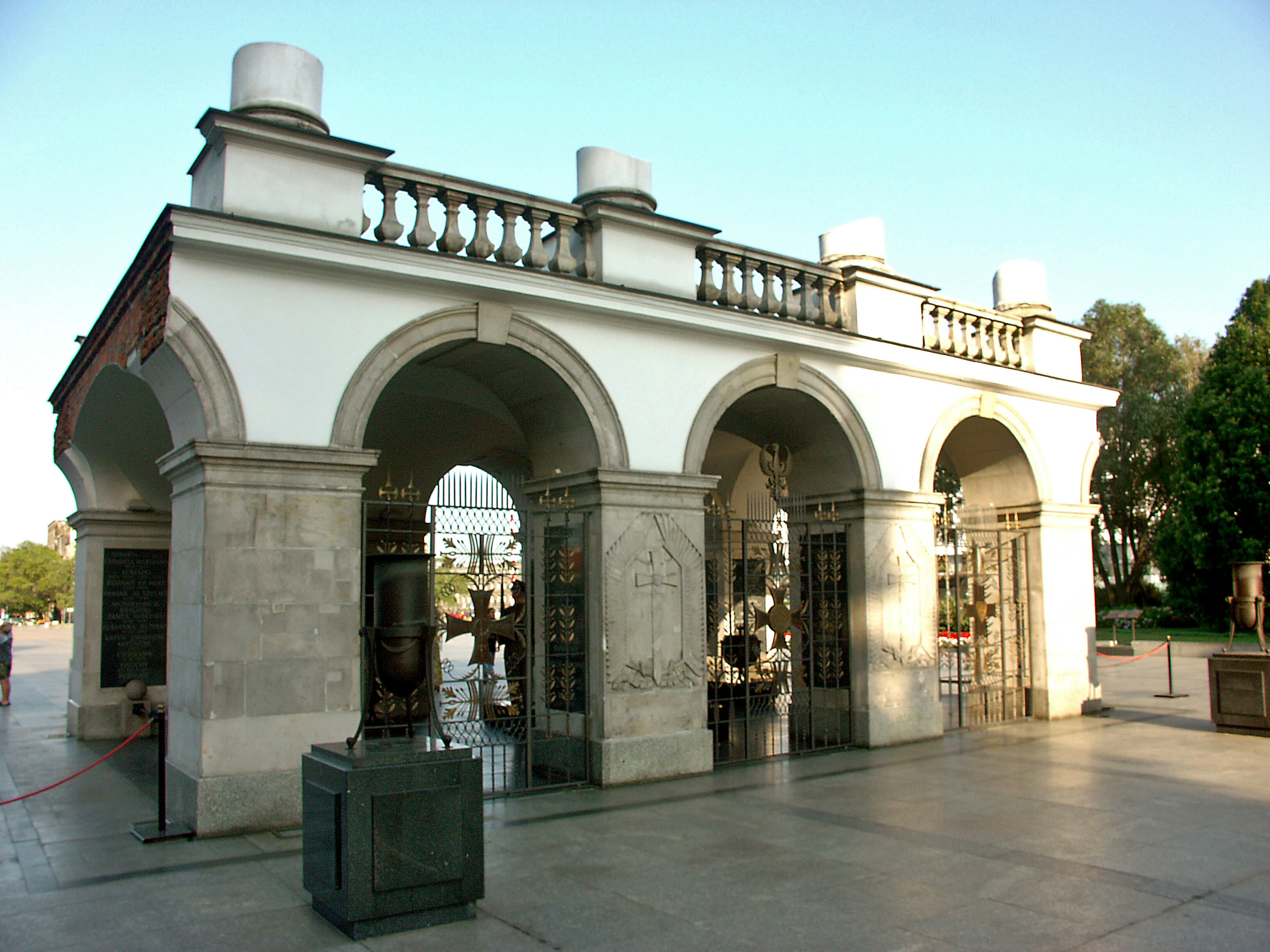 White building with arches and balcony at a monument